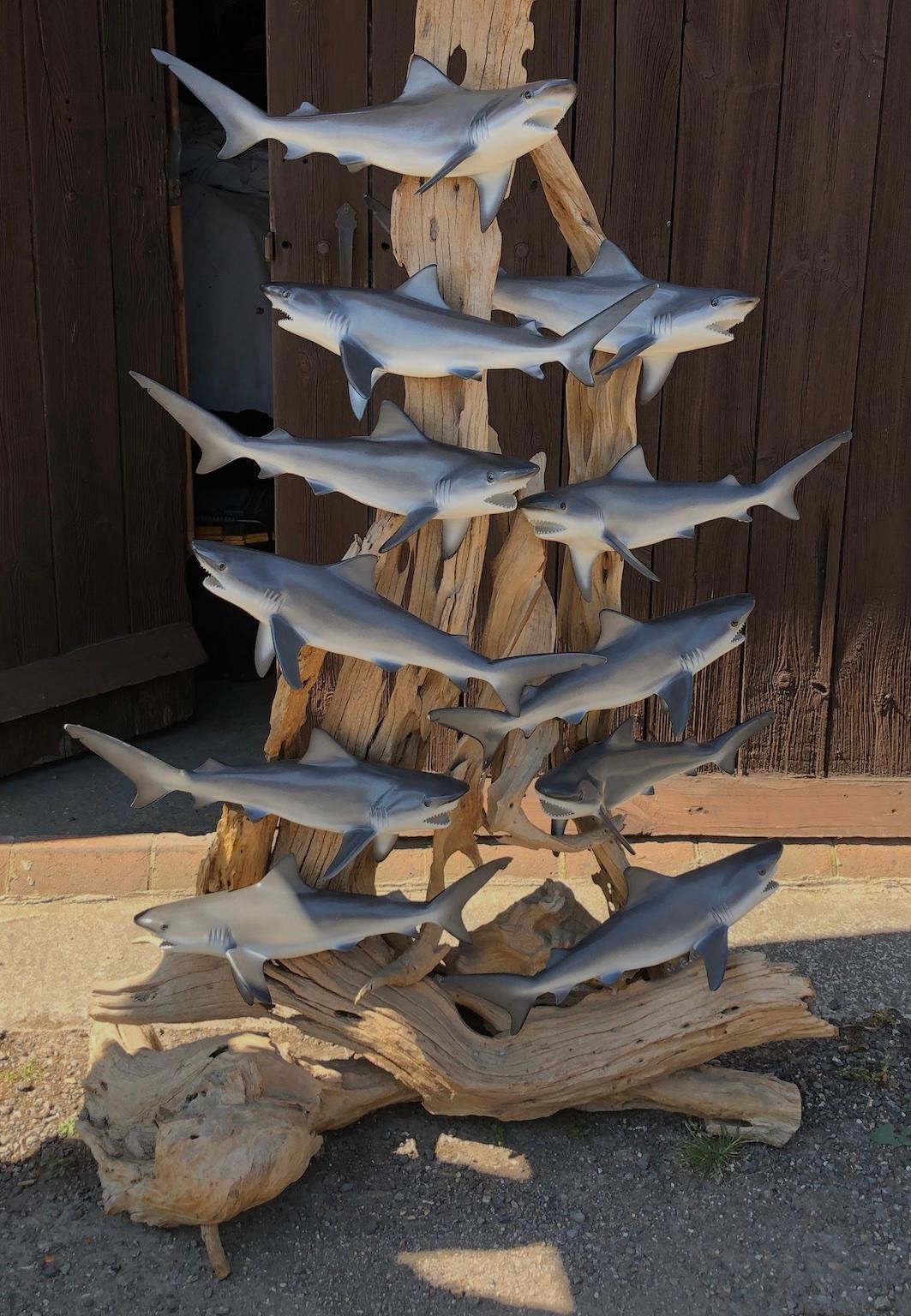 Mid-Century Modern Large solid floor standing wooden trunk Lamp embellished with baby sharks, and original shade, 
circa 1960s, Originated in the US.

This amazing and rare artisan made lamp, is embellished with 8 fibreglass sharks on a wooden