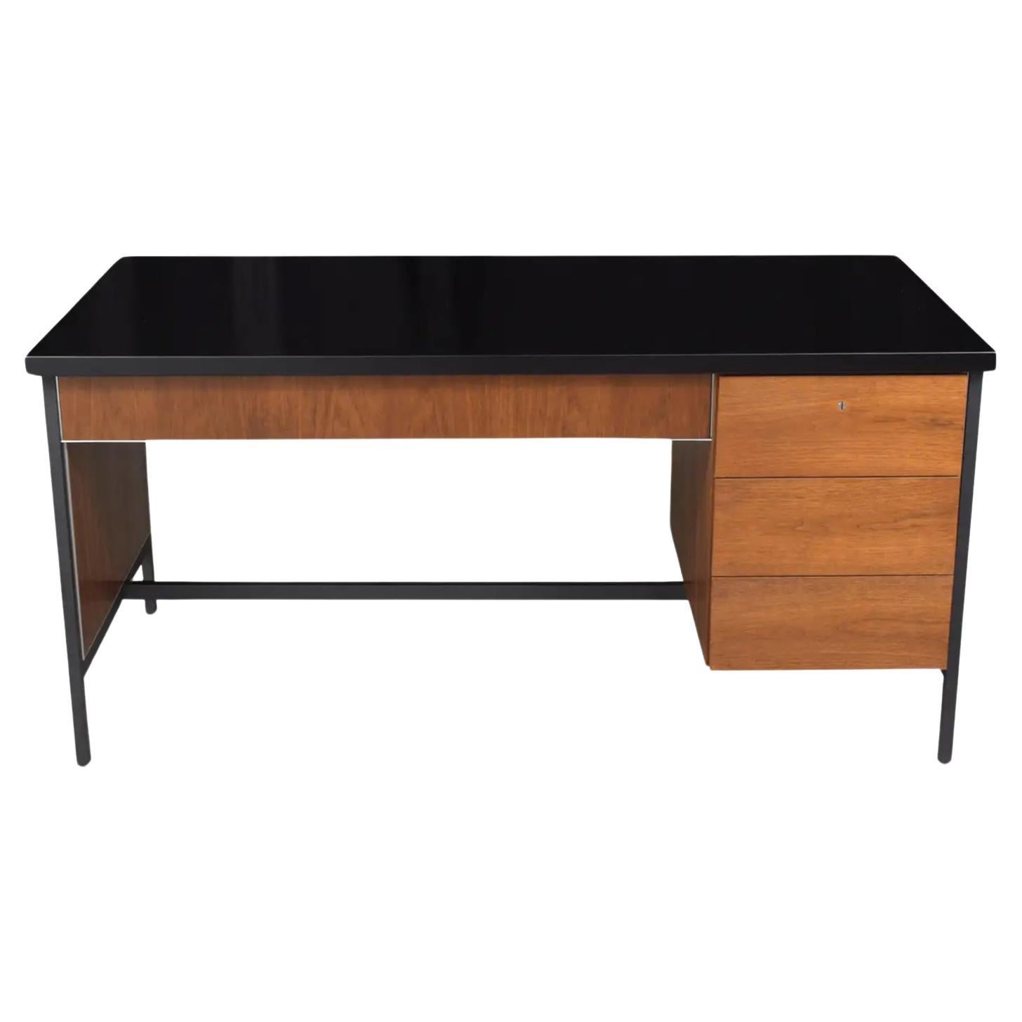 Immerse yourself in the definitive charm of the 1960s with our executive desk, inspired by the legendary Florence Knoll. This piece is a modern tribute to the sleek and innovative design ethos of the mid-century period, meticulously crafted from