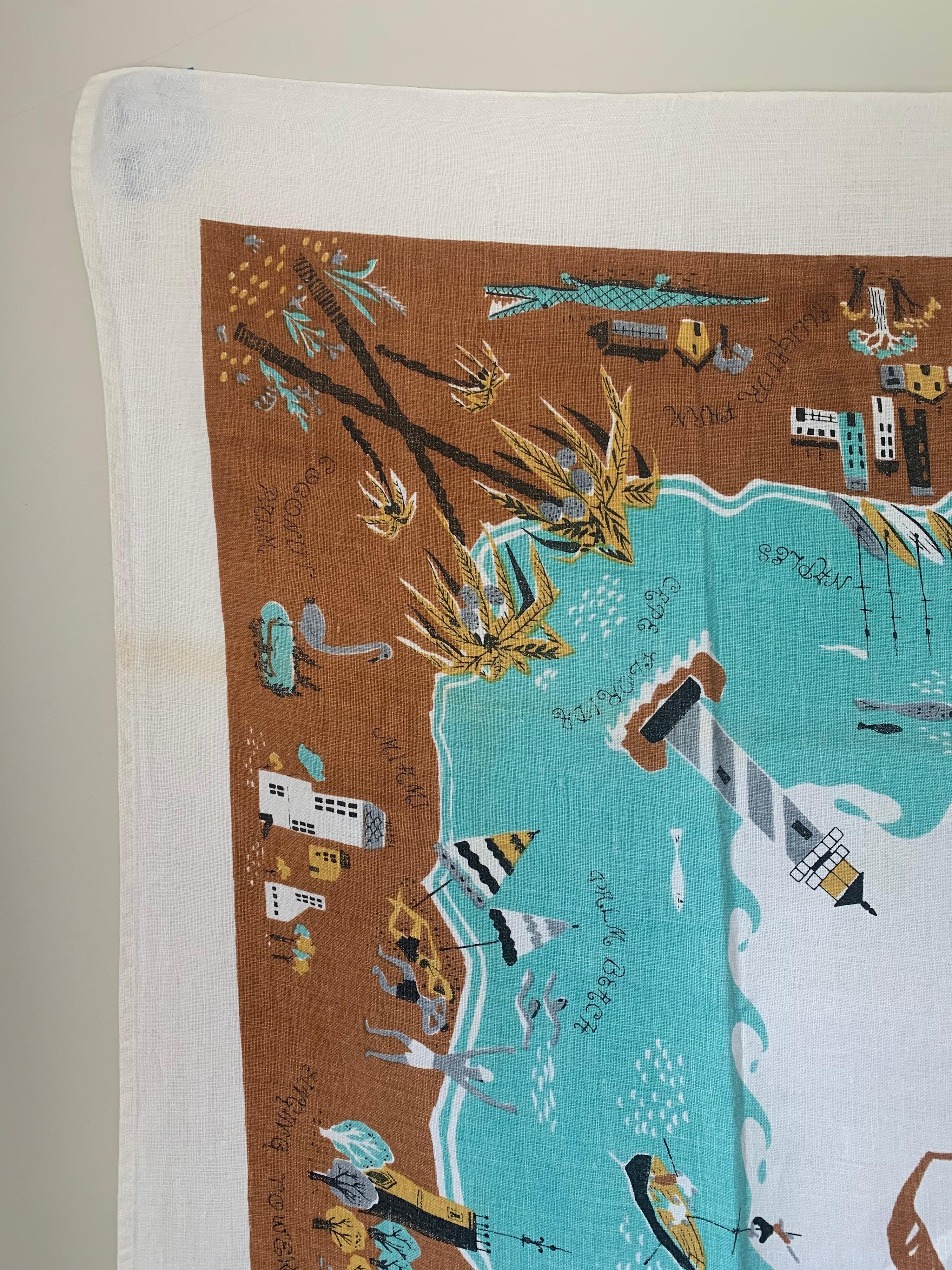 Midcentury Florida souvenir table cloth. White cotton table cloth with multi-color printed Florida landmarks. As found, lightly used condition. The cloth has been professionally pressed.