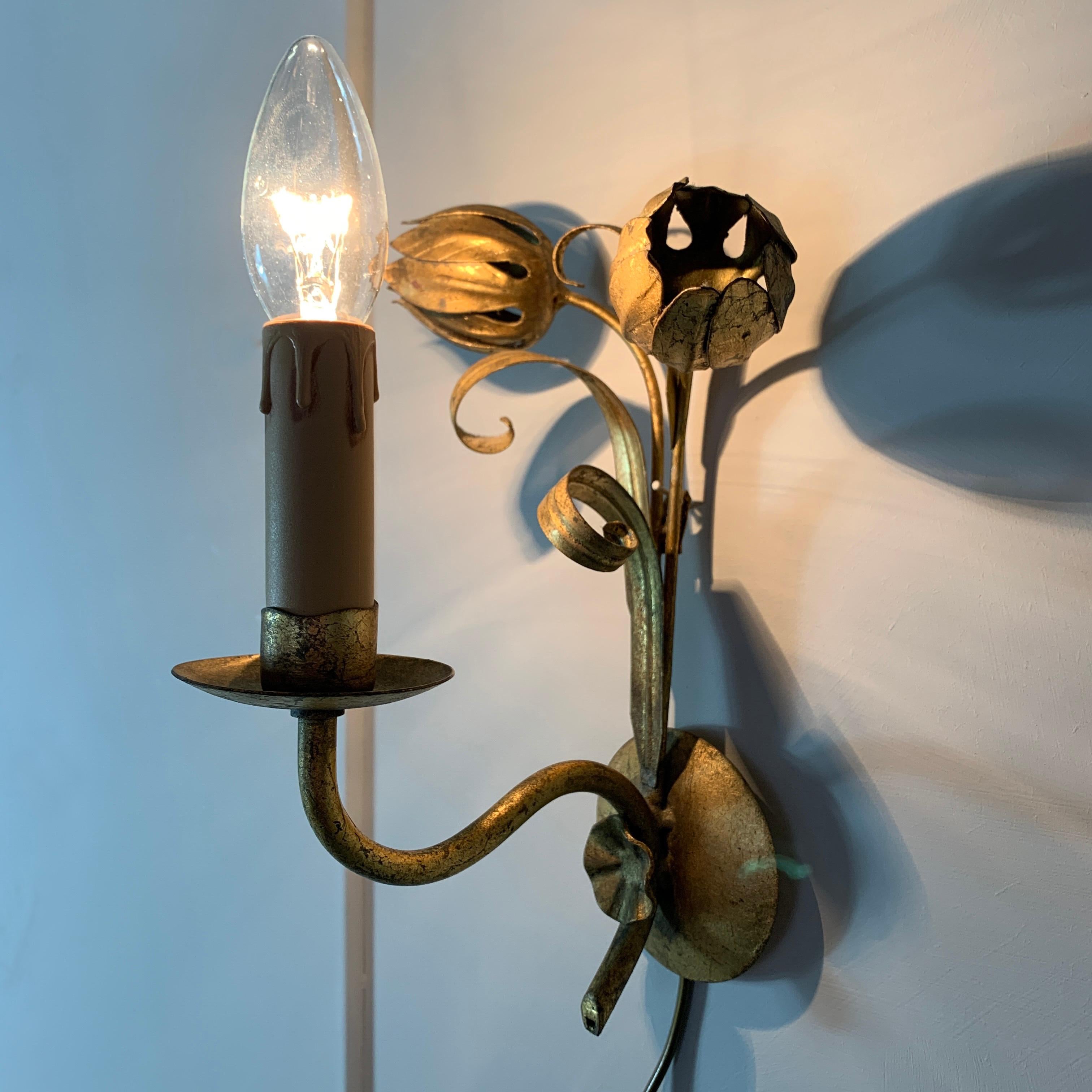 Midcentury flower bud gilt wall lights
circa 1960s, France
Pretty lights with double gilt buds and leaf design
Single bulb holder E14 to each light
Re-wired, new lamp holders and pat tested
Original gilt/gold leaf finish
Some wear to the