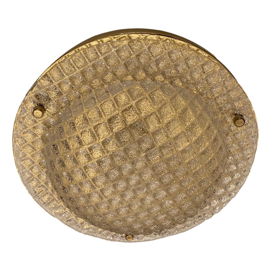 A circa 1960s Danish flush-mounted molded glass light fixture with bronze backplate.

Measurements:
Diameter 15