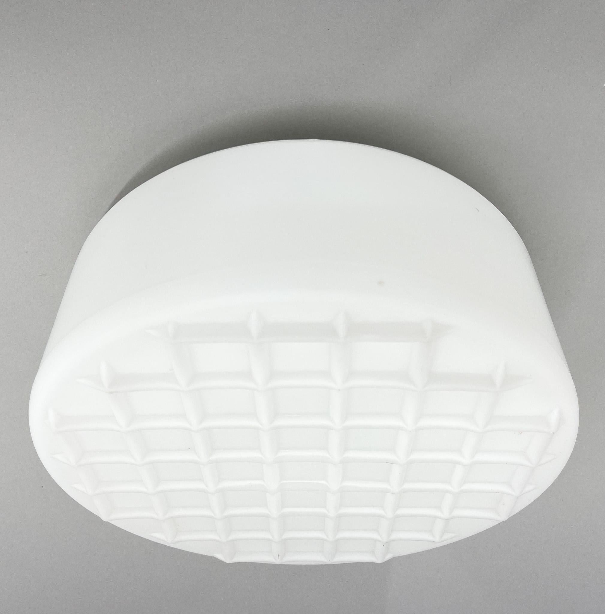Milk glass and metal flush mount, wall or ceiling light from the 1970's. There are up to 7 pieces available. Bulbs: 2 x E25-27.