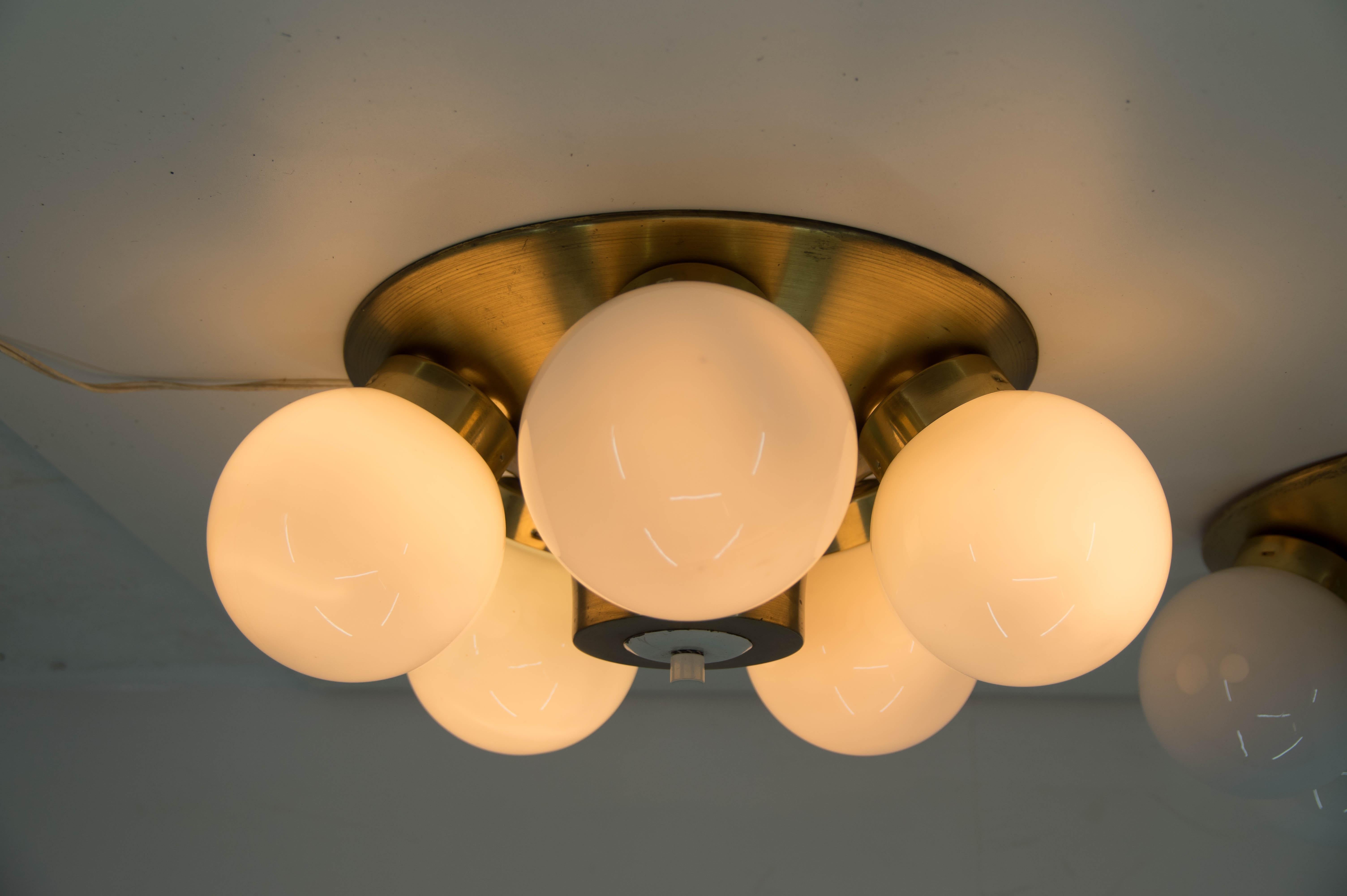 Flushmount type 77 315, made by Elektroinstala Decin in Czechoslovakia in 1970s
Made of brass and opaline glass.
Re-polished, rewired
5 x 60 W, E27 or E26 bulbs.