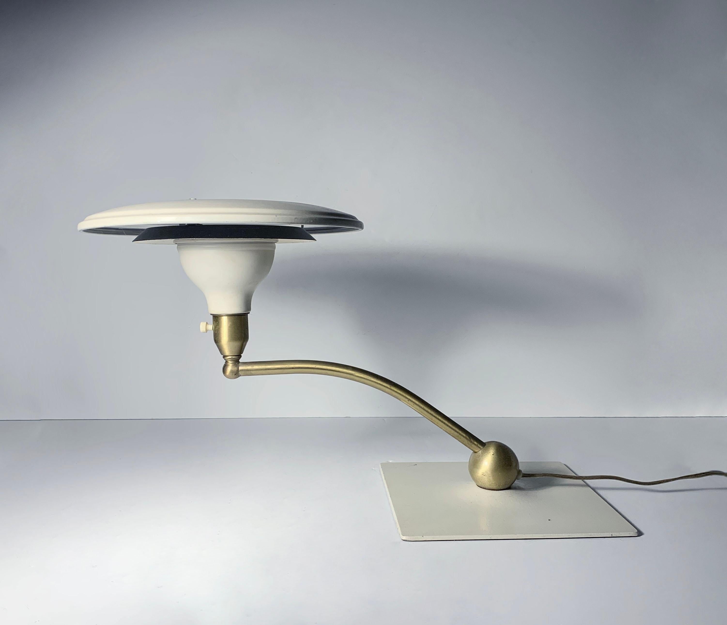 Mid century flying saucer sight light desk lamp in white by MG Wheeler.