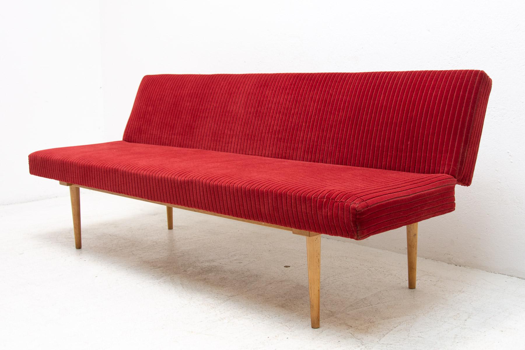 Mid century sofa/daybed, made in the former Czechoslovakia in the 1960´s, designed by Miroslav Navrátil. Material: beech wood, fabric. at one place the fabric has been sewn up in the past – it is not significantly visible and it does not disturb the
