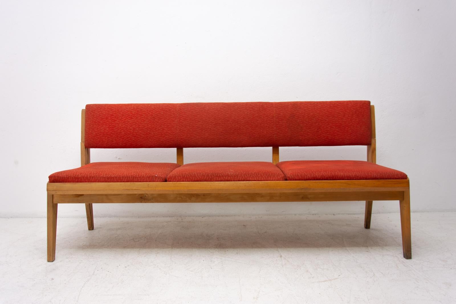 Midcentury folding sofa-bench made in the former Czechoslovakia in the 1960s. It features very attractive and simple design. Material: fabric, beechwood. The seating is composed of 4 removable upholstered parts. These parts are in good condition,