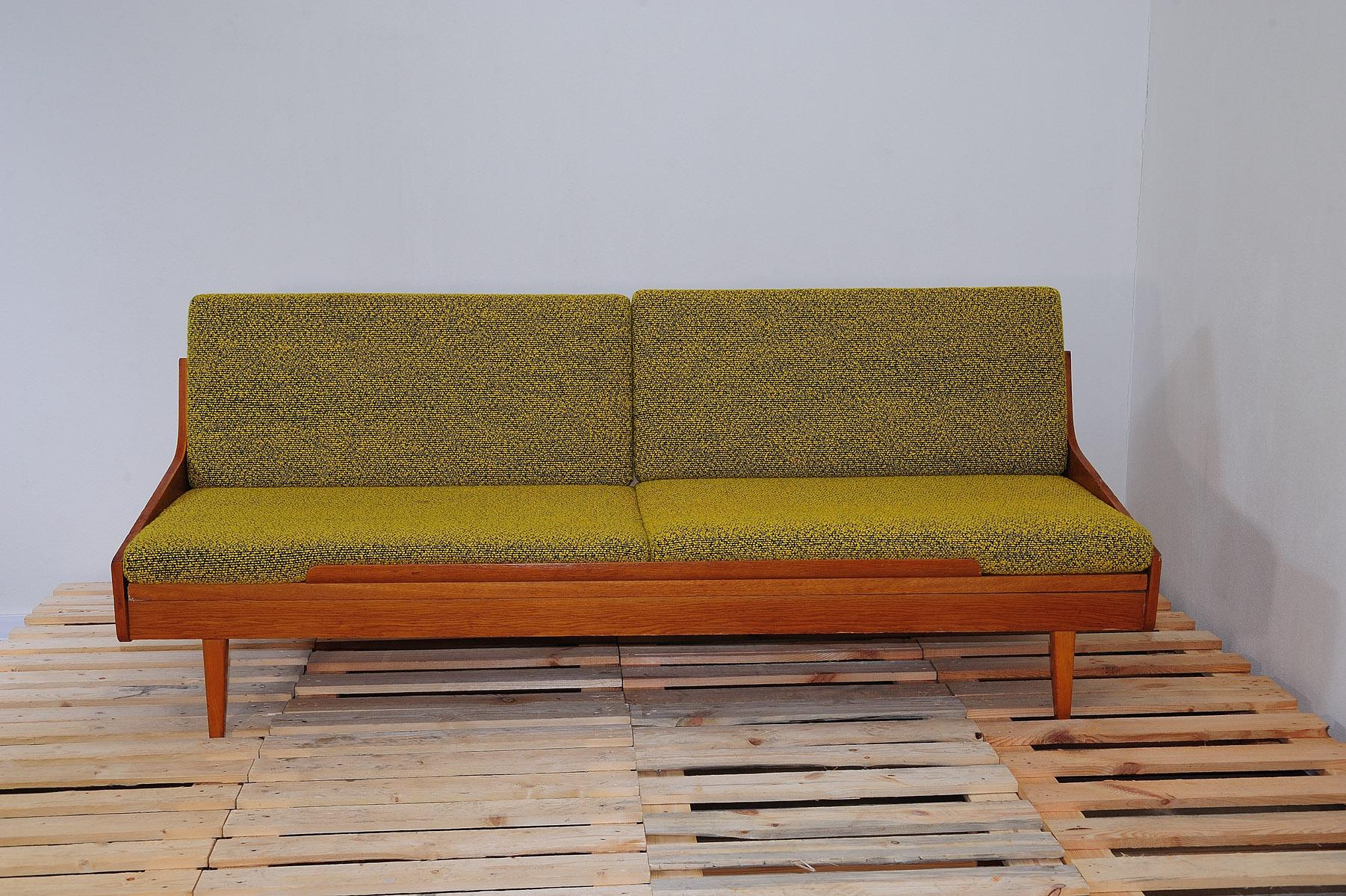 Mid century sofabed from Interiér Praha. It was made in the former Czechoslovakia in the 1960´s. This sofa has a wooden structure that is veneered in beech wood. The mattresses are rather soft.

The sofa is in very good Vintage condition, showing