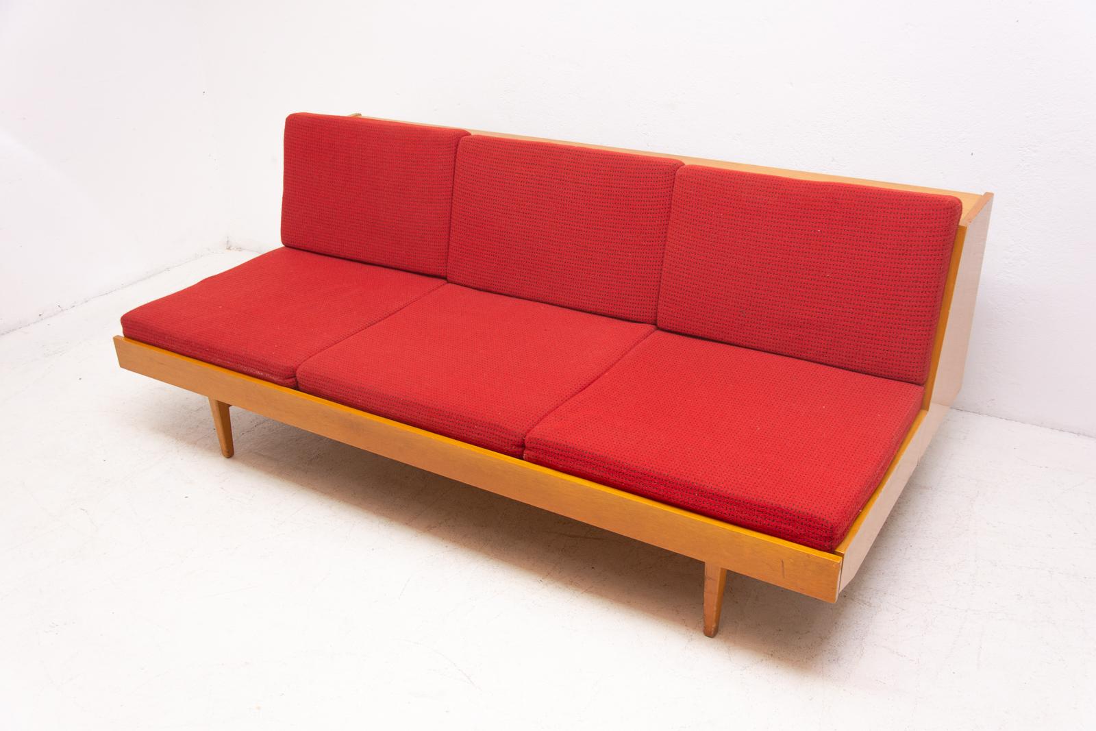 Midcentury sofa bed, made in the former Czechoslovakia in the 1960s. This sofa has a wooden structure, it´s is in good preserved condition, showing signs of age and using.

Measures: Sleeping area: 134 x 192 cm

Seat height: 40 cm.