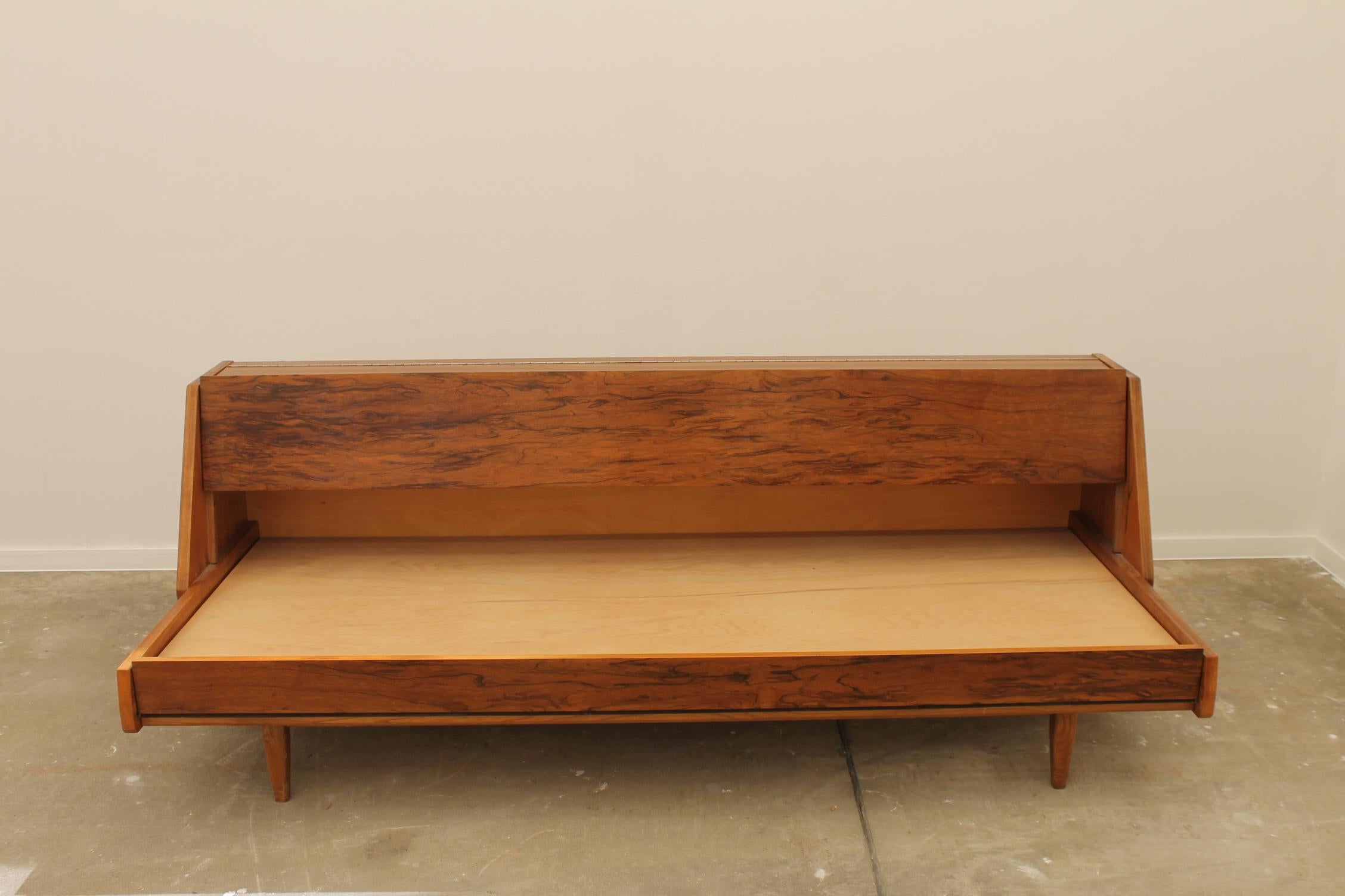 Midcentury sofa bed,made in the former Czechoslovakia in the 1970s. The sofa has a wooden structure with walnut veneer, it´s in very good condition, shows slight signs of age and using.

Lenght: 201 cm

Height: 70 cm
Depth: 83 cm

Sleeping