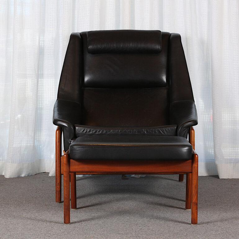 Folke Ohlsson profile teak & leather armchair with footstool. All original condition. Leather in good condition with no rips or tears. Made in Denmark. C.1960. 