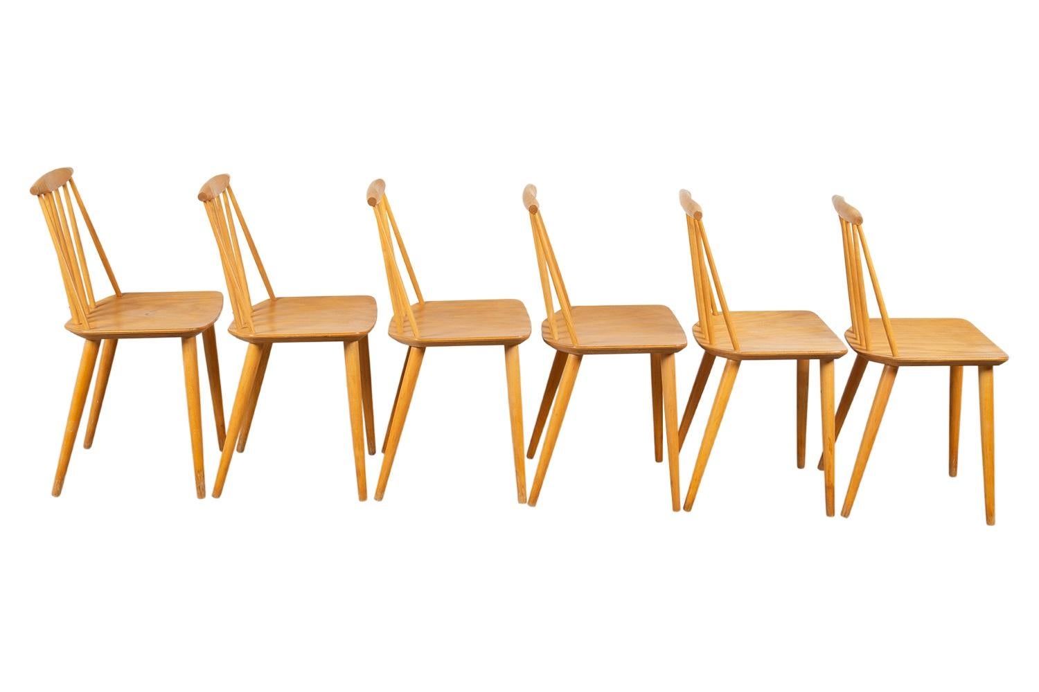 Beautiful set of six, Spindle Back, model J77 Chairs by Folke Palsson for FDB Mobler, Denmark circa 1970’s. They are of solid wood construction featuring a concave serpentine crest rail above six turned spindles. The scooped seat is nicely formed