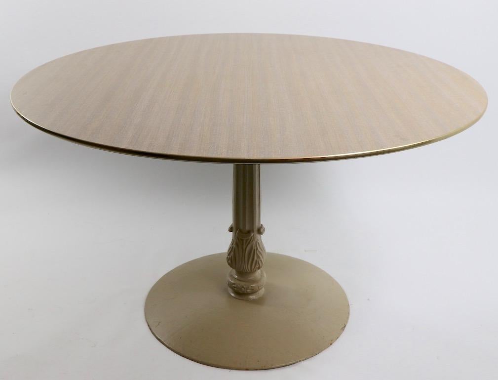 Stylish cafe, restaurant dining tables, originally from a midcentury Poconos Pennsylvania resort. Faux wood grain formica tops, having a beveled edge, and gold tone rim. Bases are heavy cast iron, tables are commercial grade construction, clean and