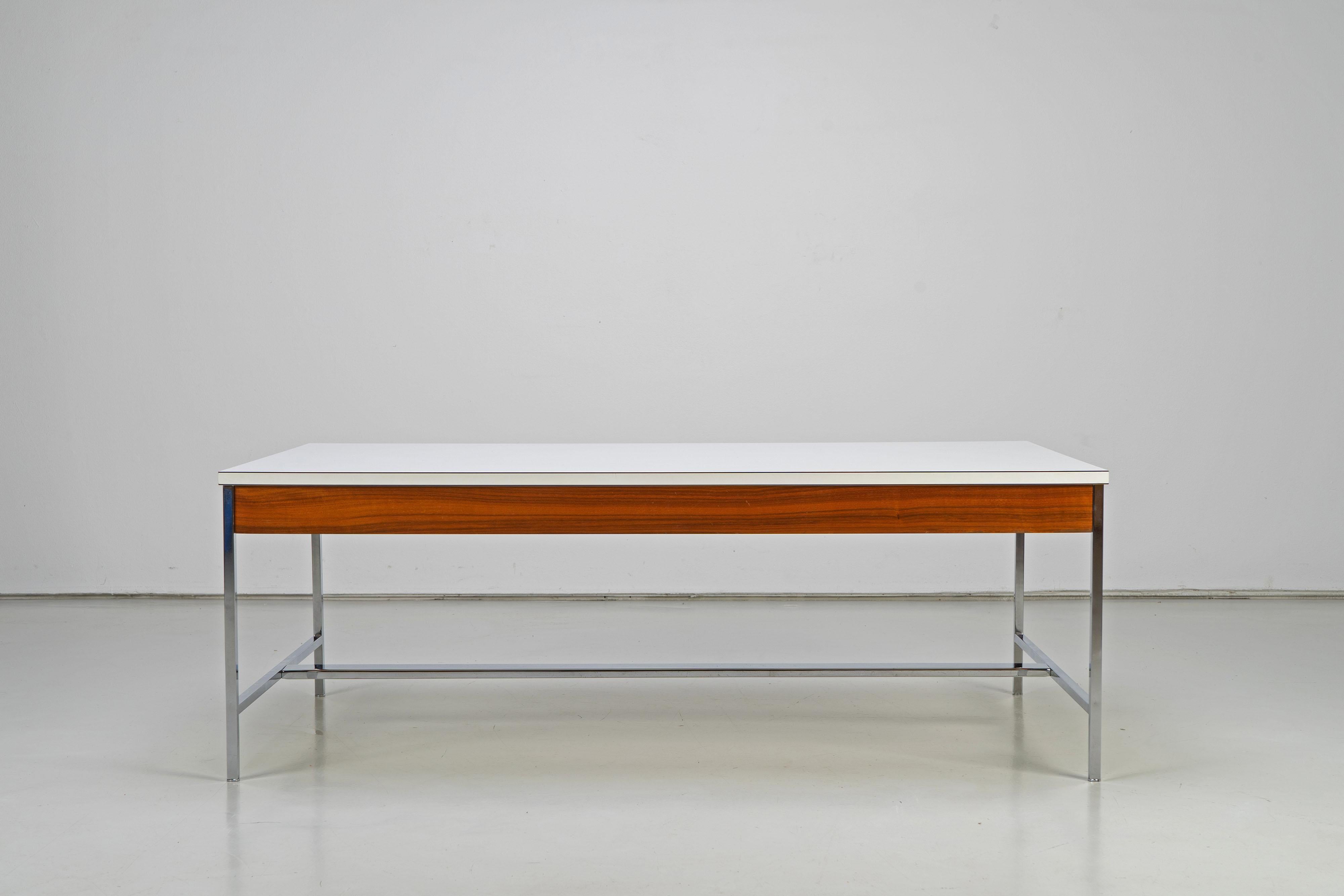 Coffee table Model 5751 designed by George Nelson, produced by Herman Miller in the 1960s. Formica and walnut on chrome frame.