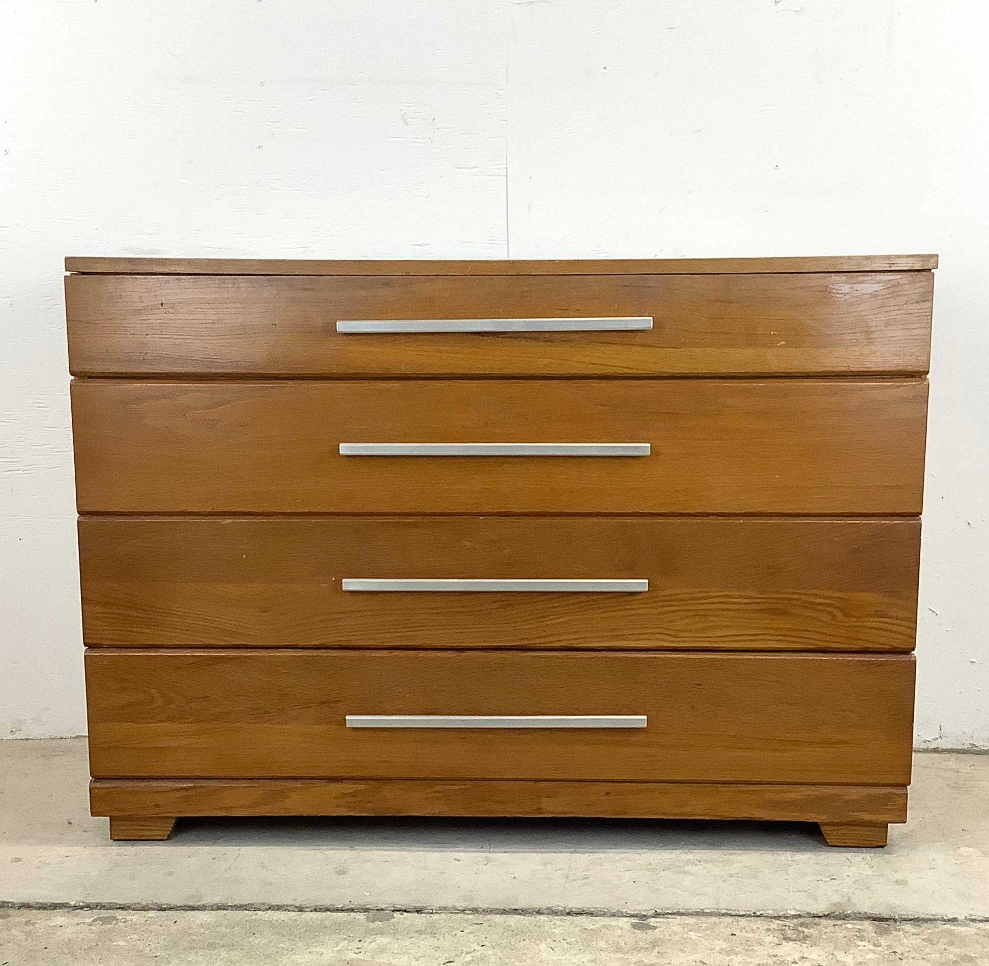 Immerse yourself in vintage sophistication with this Raymond Loewy designed Mid-Century 4-Drawer Dresser, manufactured by Mengel Furniture. This exquisite piece not only encapsulates the functionality of modern design but also carries the legacy of