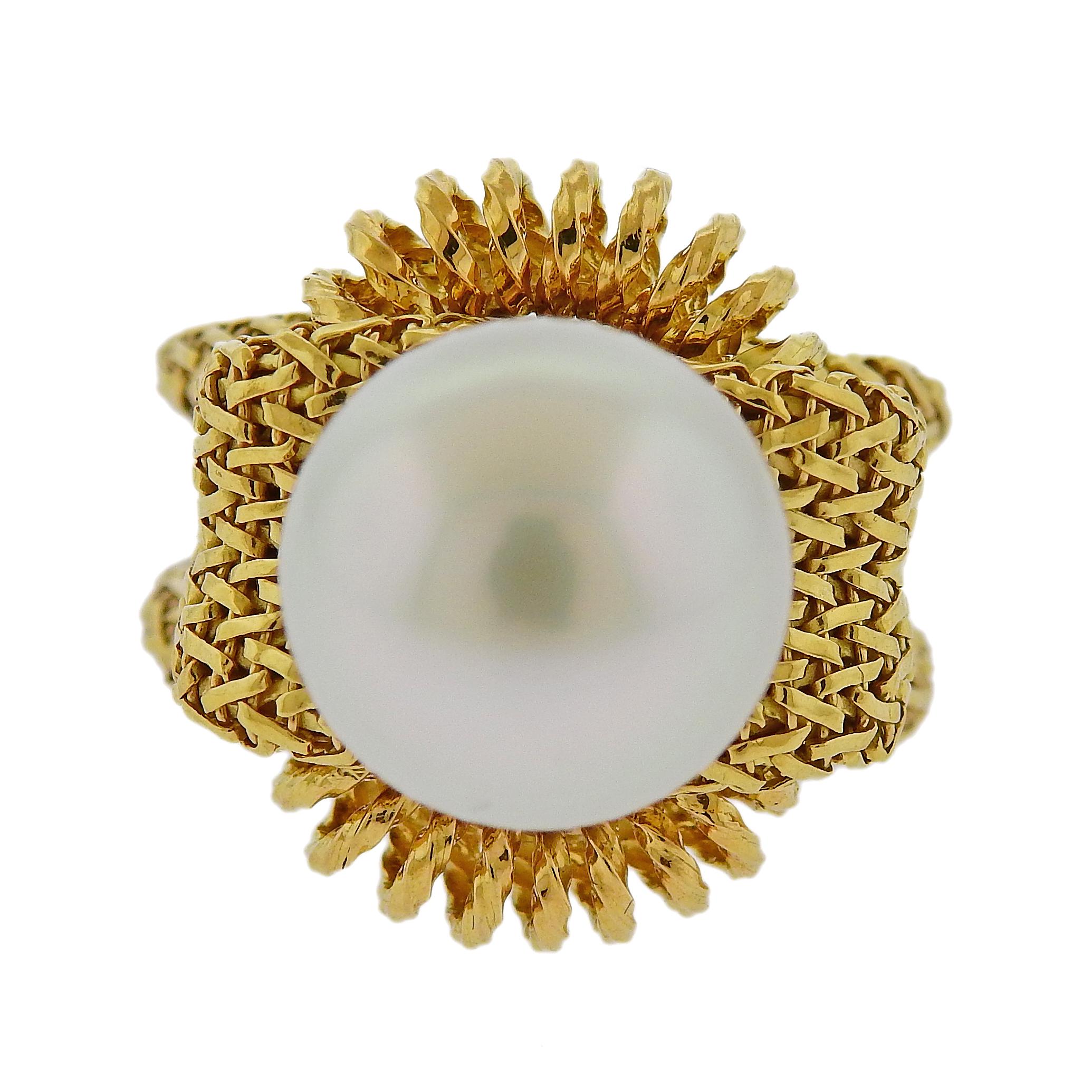 Made in France, 18k yellow gold woven ring, featuring 14mm South Sea pearl. Ring size 5.5, ring top is 22mm x 22mm, sits approx. 24mm from the finger when worn. Marked: made in France. Weighs 24.4 grams. 

SKU#R-03059