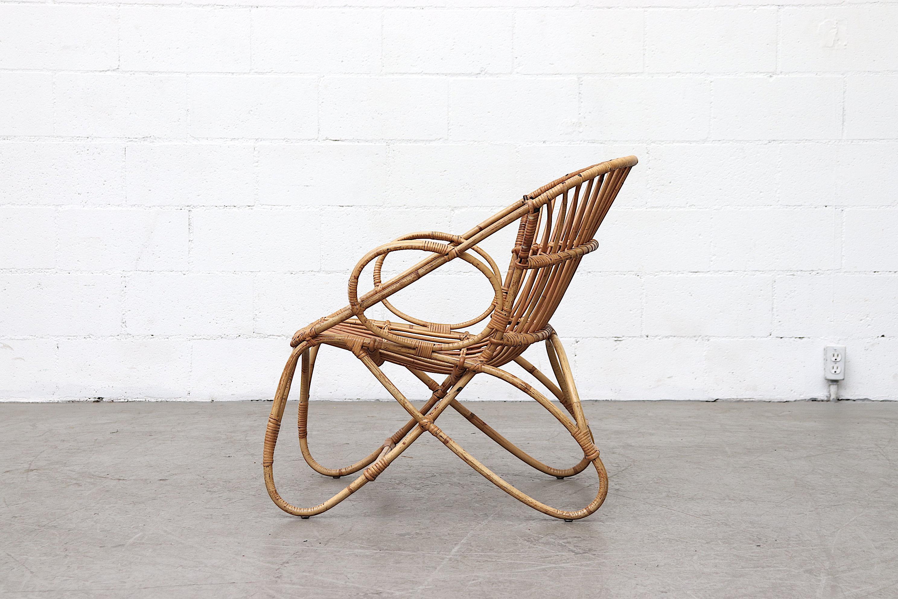 Lovely Franco Albini style bamboo lounge chair in good original condition with minimal material loss, light weight and comfortable. Visible wear consistent with its age. Similar styles available.