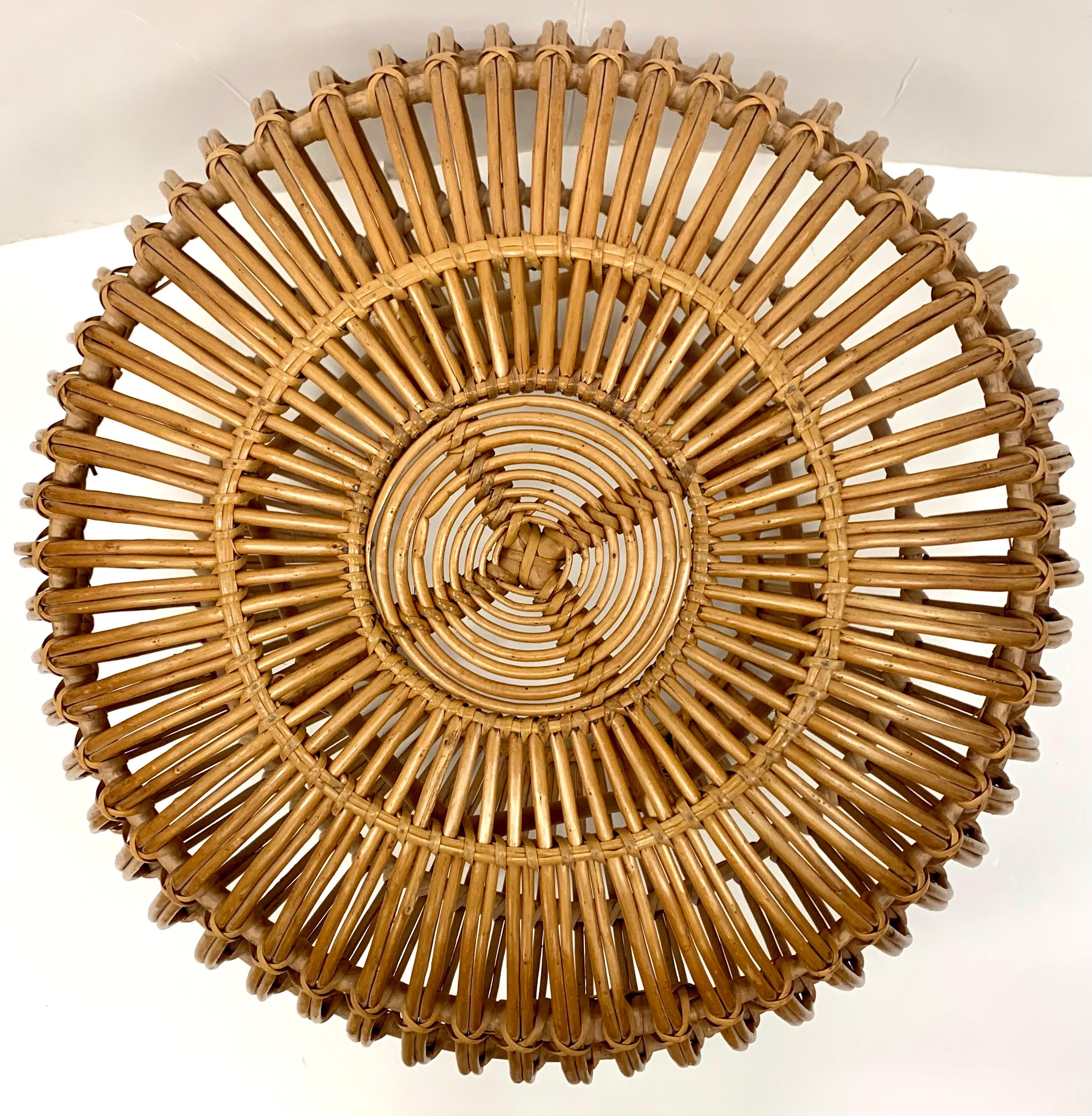 Vintage Franco albino style round handwoven rattan, wicker ottoman, pouf, footstool or side table.