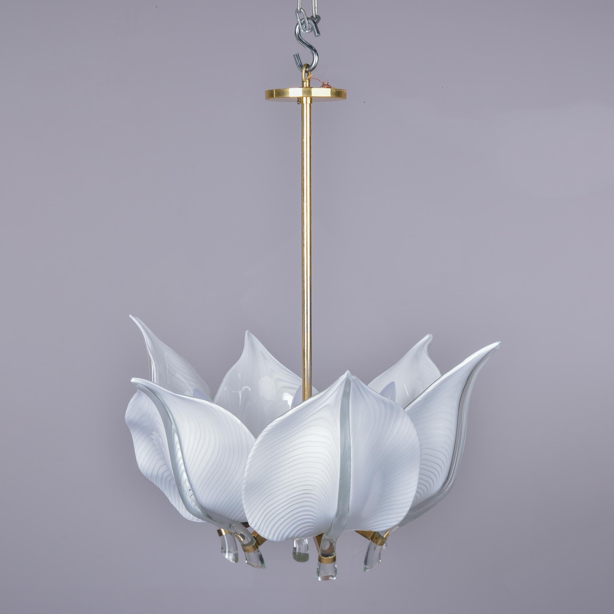 Circa 1970s Murano glass fixture designed by Franco Luce for Seguso. Polished brass frame supports six white colored mouth blown glass leaves. Fixture has six standard sized sockets.  New wiring for US electrical standards. 

Rod = 24”              