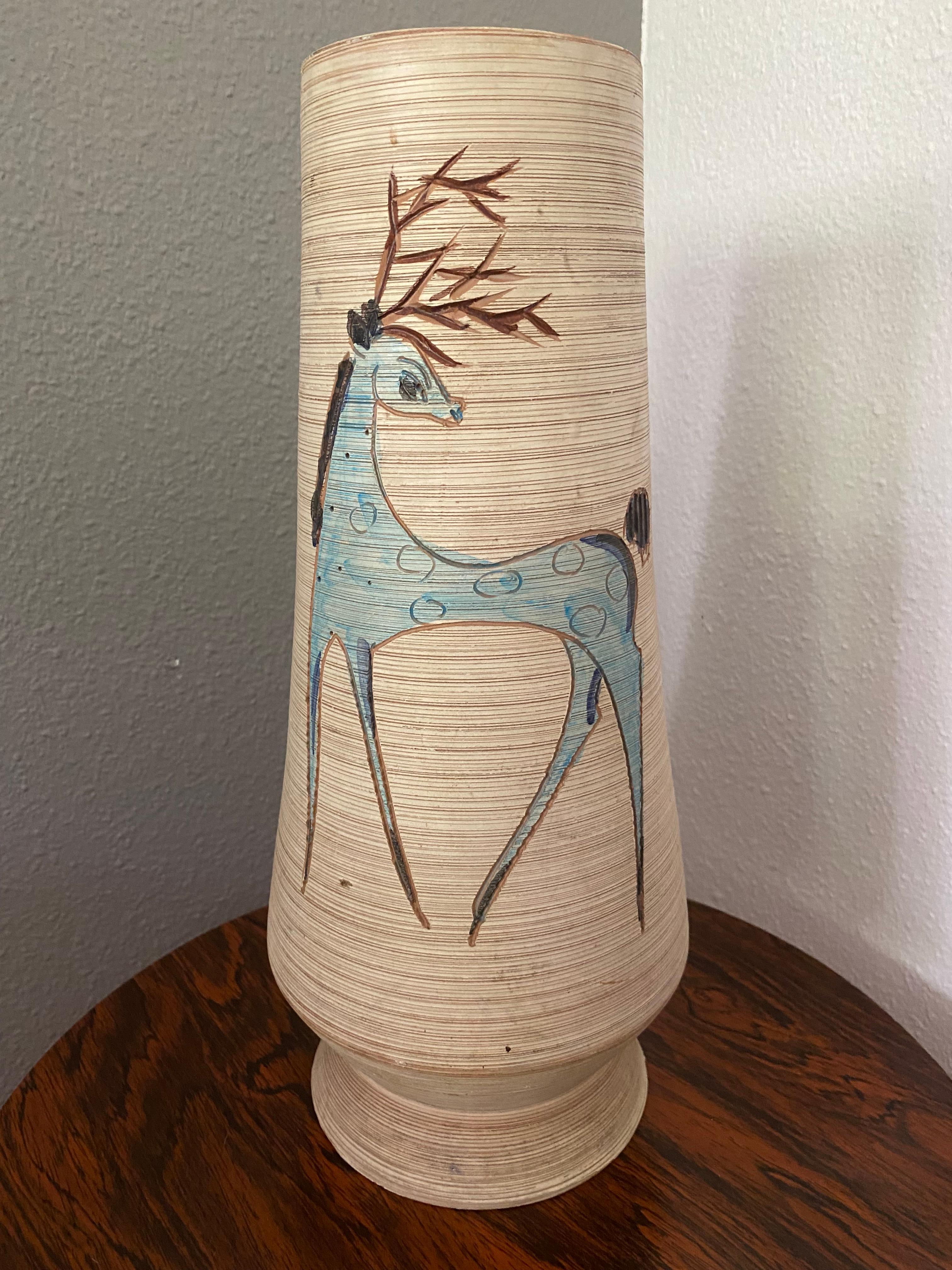 Stunning and vibrant, 38cm high, vase with sgrafitto and hand-painted colored glossy pattern of a blue deer.. On the base is painted Italy V.D. 14.

Fratelli Fanciullacci Pottery: during the first half of the 20th century the firm slowly branched