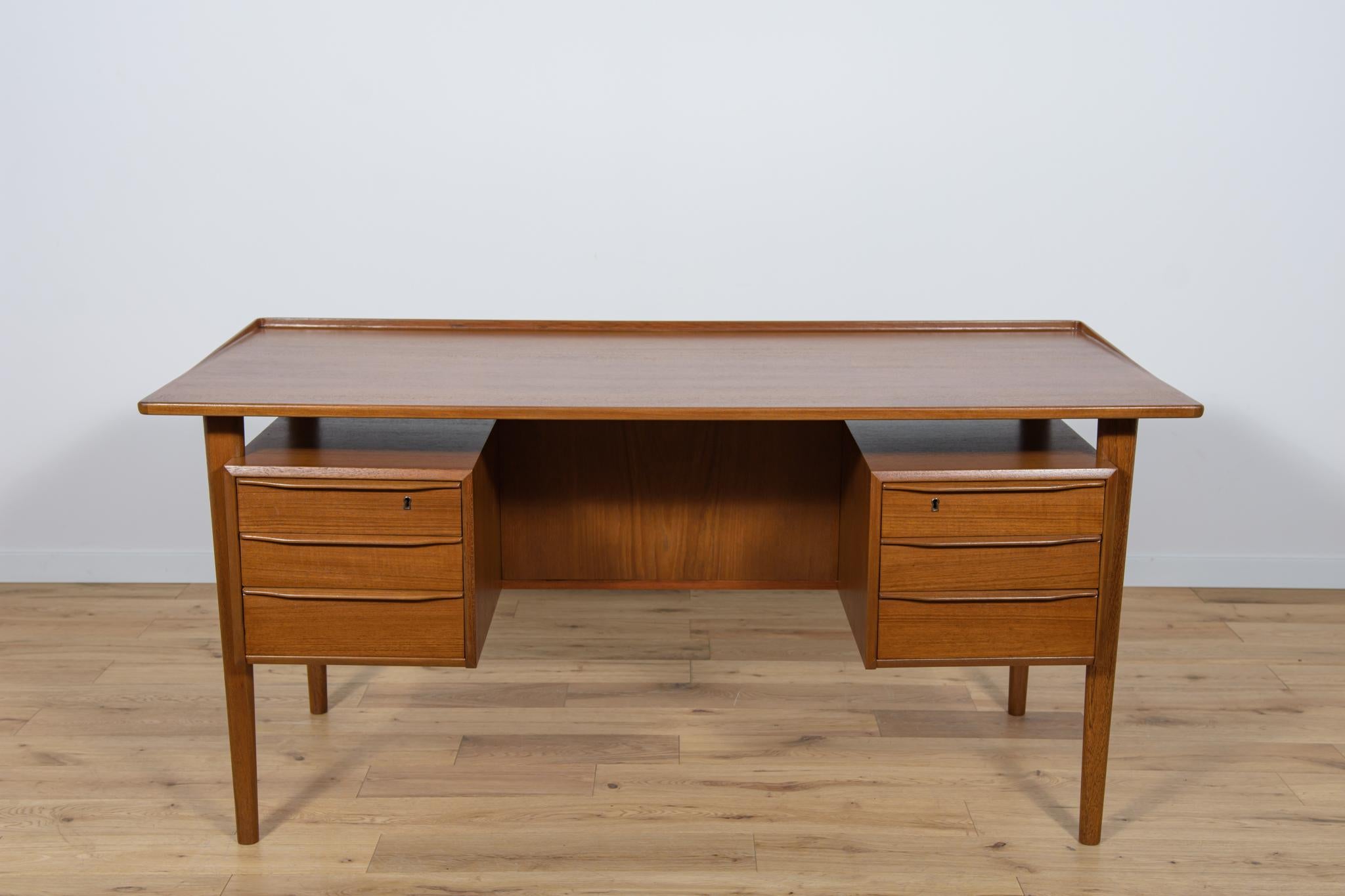 A desk designed by Danish designer Peter Løvig Nielsen in the 1960s. Desks are characterized by original, extraordinary design and high-quality workmanship made of high-quality materials. The desk has a top with a contoured edge. The desk is made of