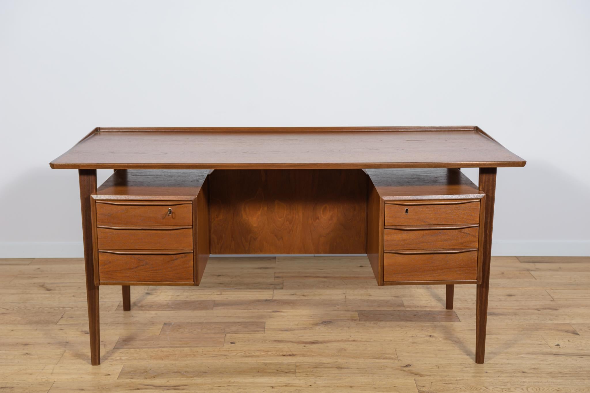 A desk designed by Danish designer Peter Løvig Nielsen in the 1960s. Desks are characterized by original, extraordinary design and high-quality workmanship made of high-quality materials. The desk has a top with a contoured edge. The desk is made of