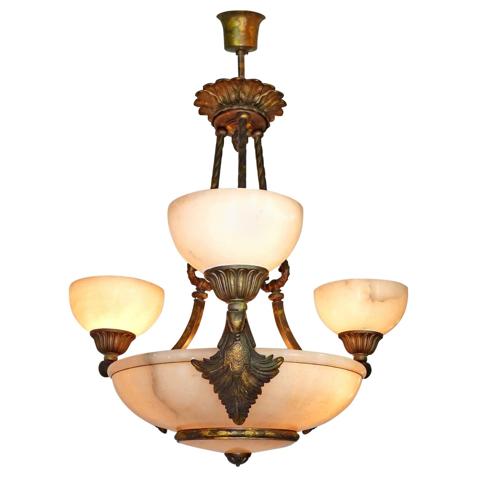 French Art Deco Art Nouveau neoclassical marble chandelier. Age patina
Six light bulbs (E14/60W)
Good working condition
Measures:
Diameter 27.5 in / 70 cm
Height 49.2 in (27.6 in + 21.6 in) / 125 cm (70cm + 55 cm)
Weight 36 lb. (16 kg).
Assembly