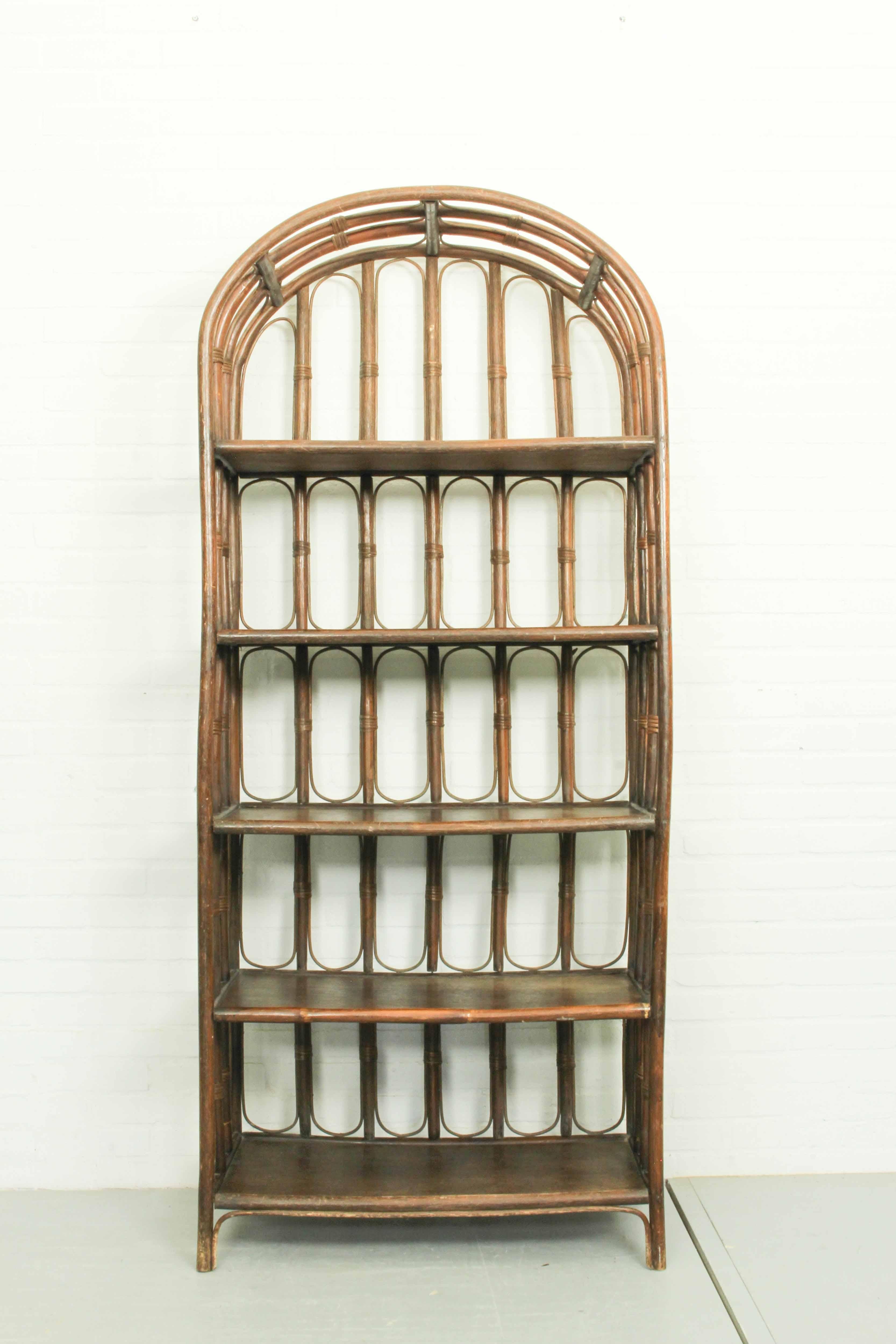 Beautiful bamboo and rattan dark brown bamboo shelves in the style of Maison Baguès. French, circa 1960.