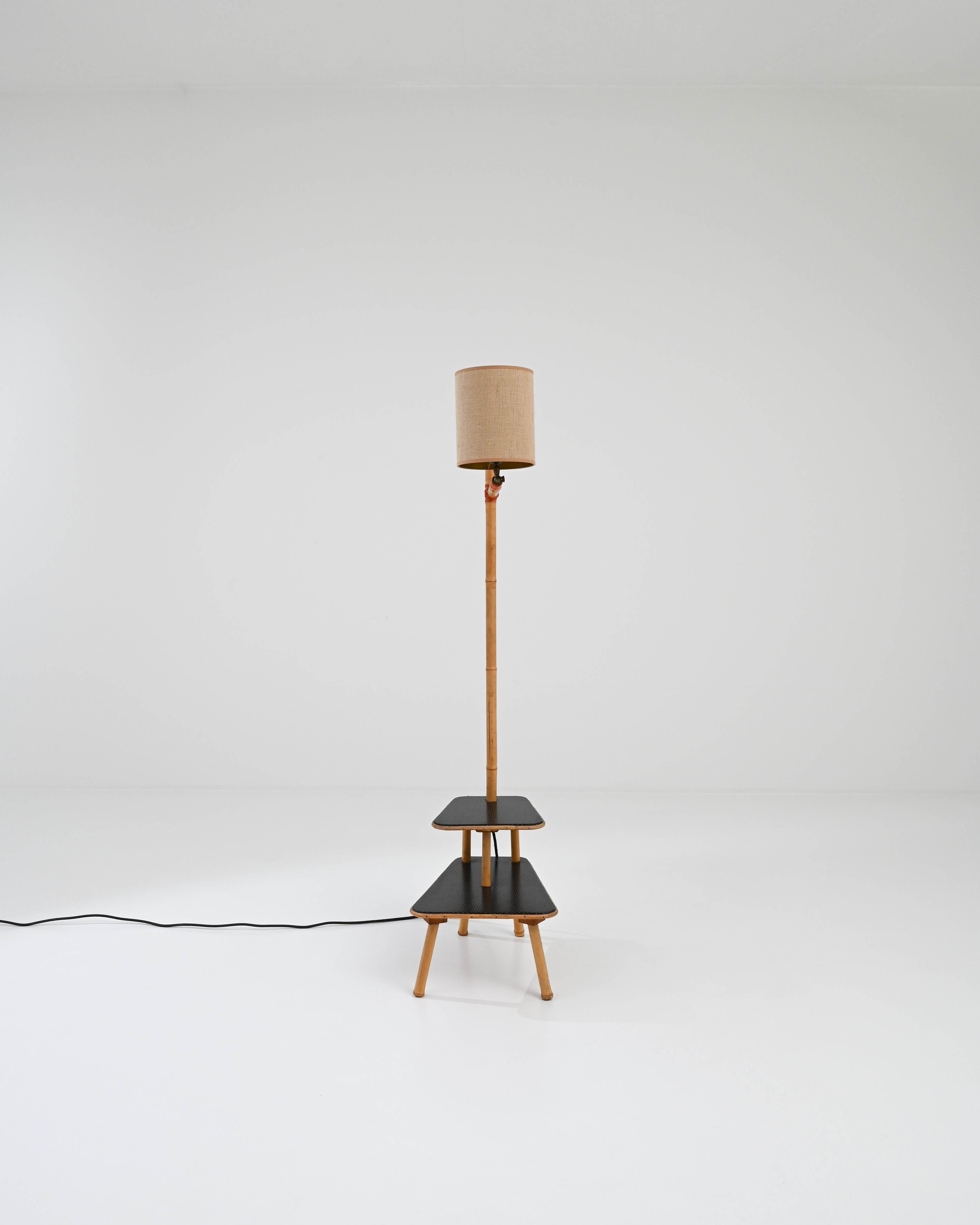 A bamboo floor lamp that makes a perfect companion in any reading break taking space. Versatile enough to be a bedside table, end table, little book stand or simply a freestanding lamp, its modernist simplicity descends from the tradition of making