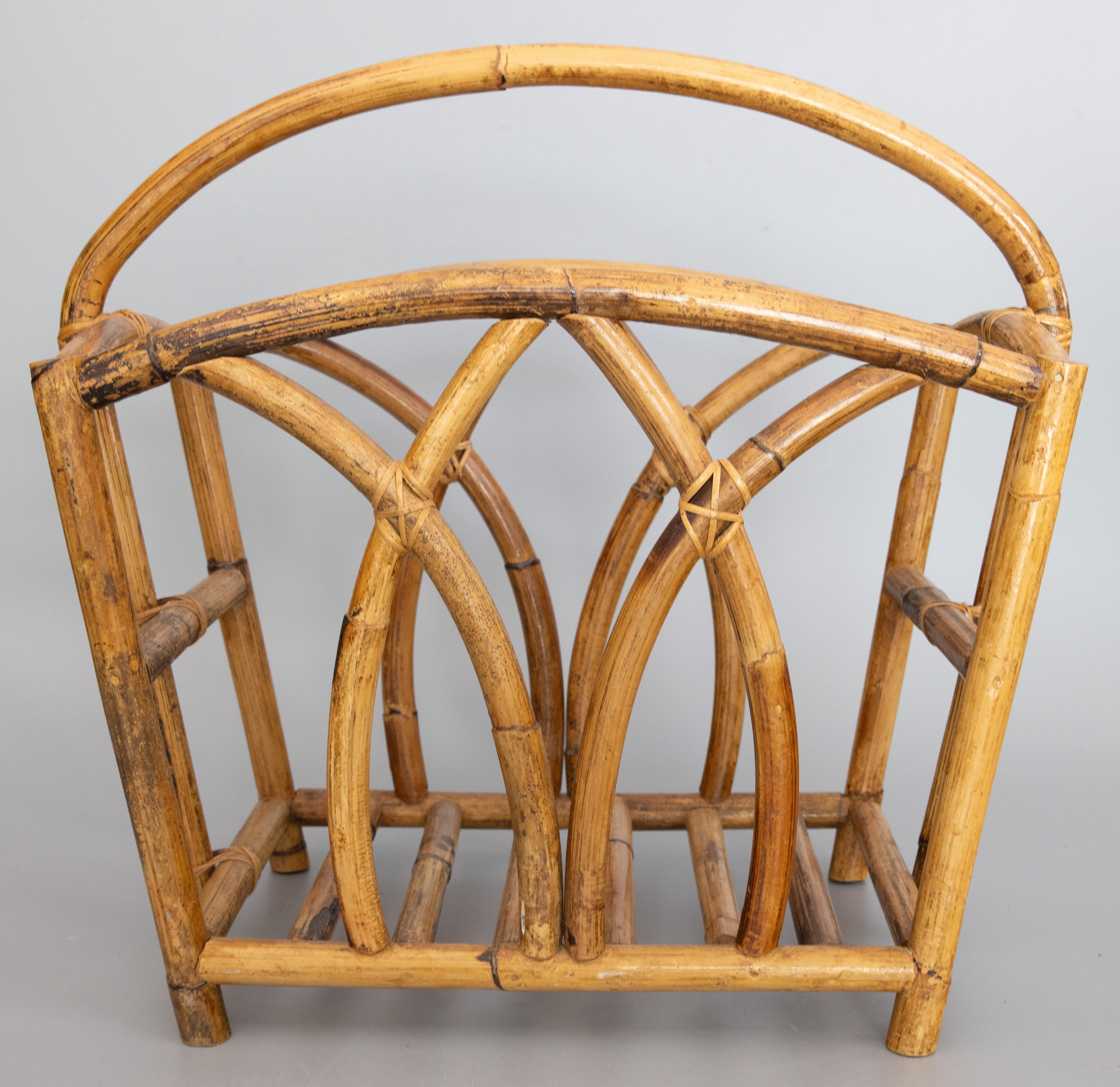 A stylish Mid-Century French bamboo magazine rack. It's a nice large size with a lovely curved design, perfect for storing magazines or books.

DIMENSIONS
20.25ʺW × 9.5ʺD × 18.75ʺH