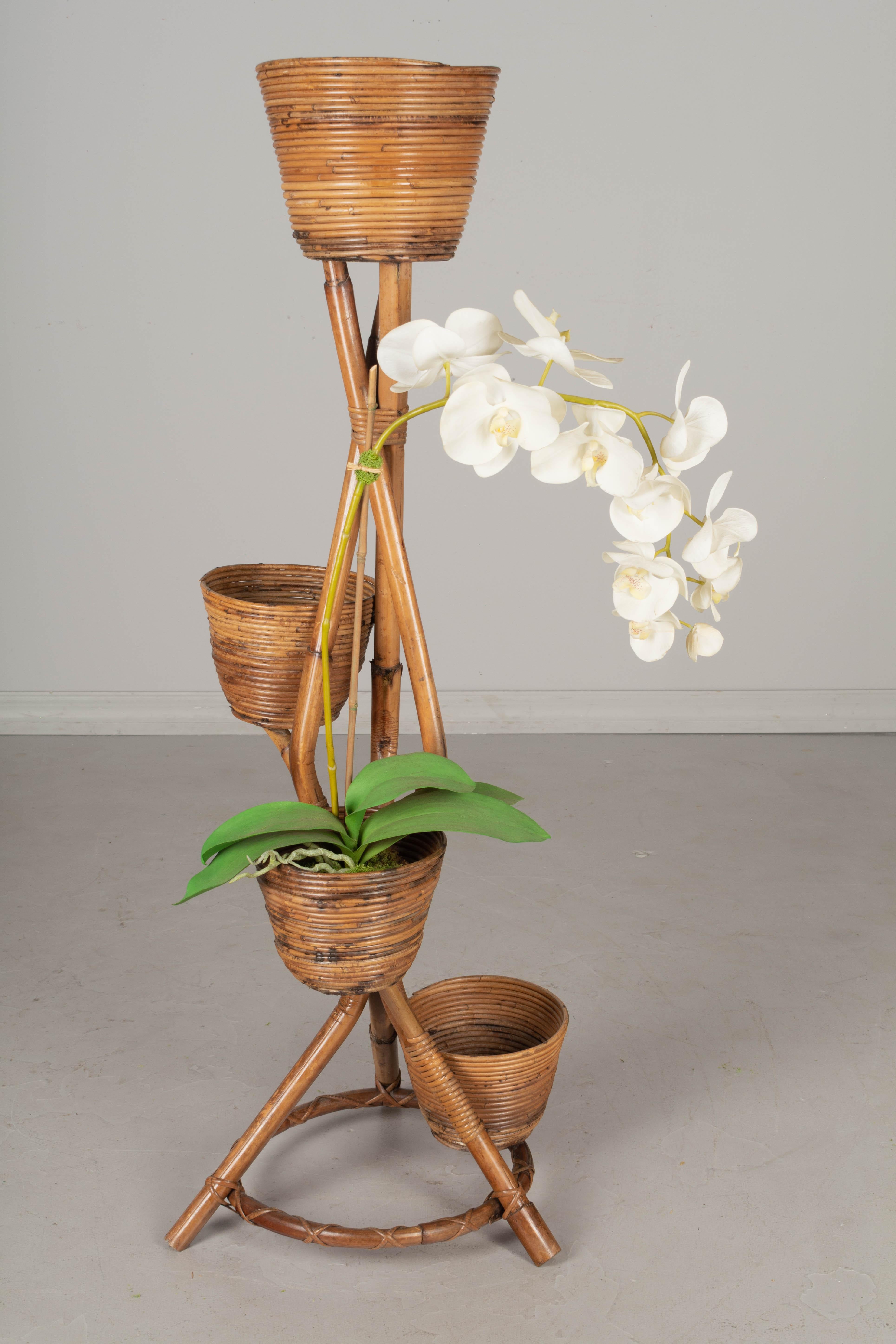 A Mid Century French bamboo and rattan plant or flower stand. Sturdy and in good condition. Perfect for the display of orchids or ferns. We have a large collection of rattan furniture from the French Riviera.
Contact us for a competitive shipping