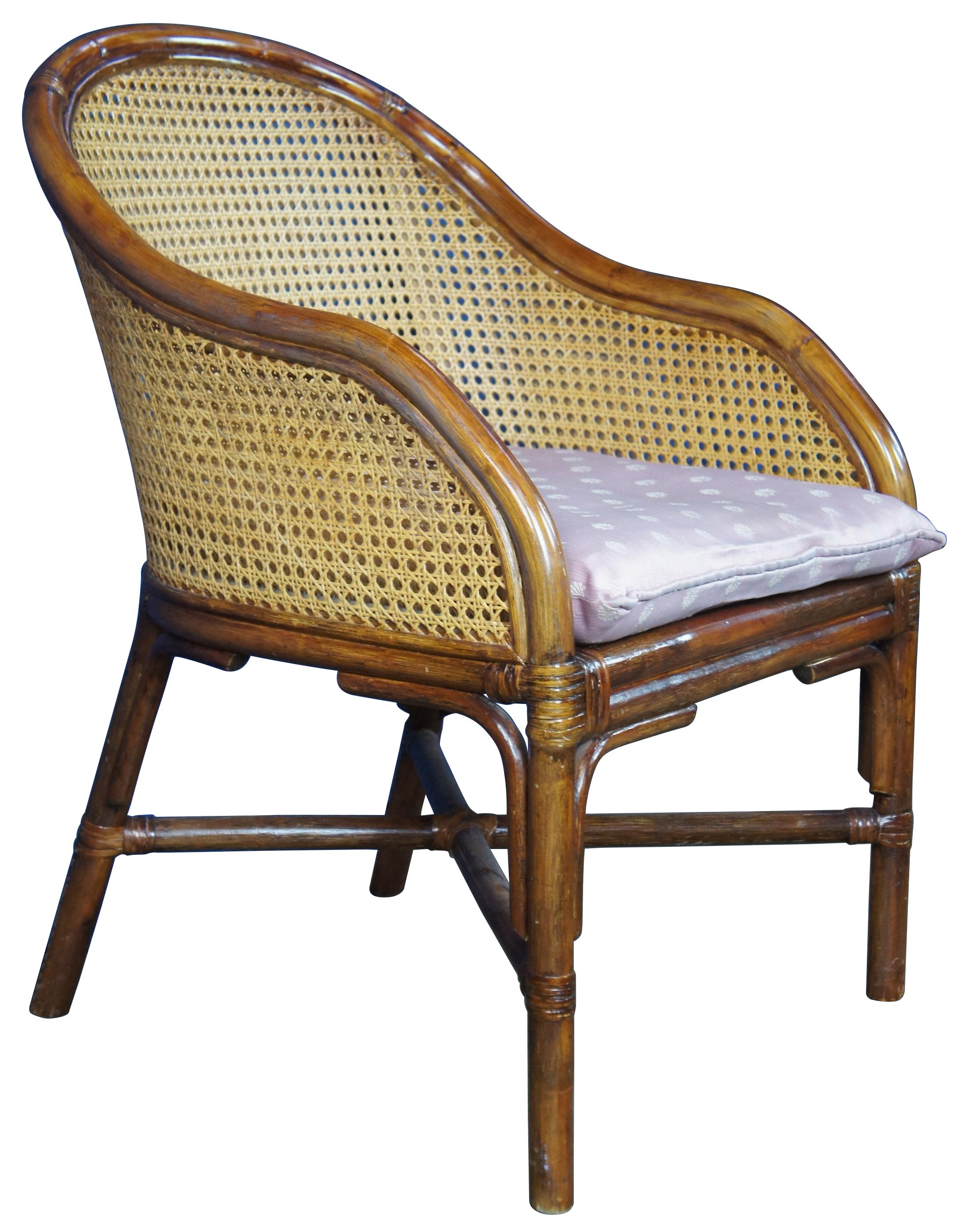 Vintage French bergere club or lounge chair. Made of bamboo and rattan featuring round double caned back with sloped arms supported by legs connected with X base.
   