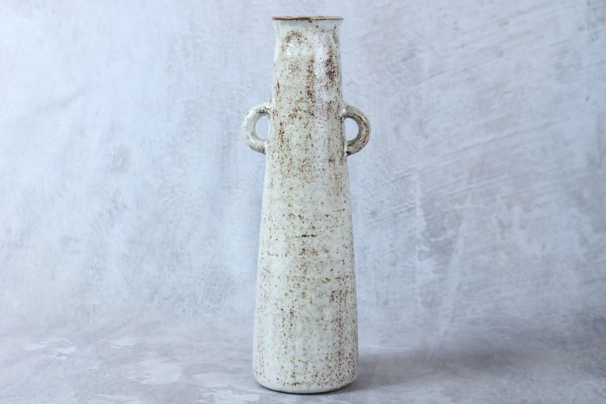 Mid-century French big ceramic vase by Jean Rivier, 1950's

A two-handled milky white glazed ceramic vase. 
Signed below: 