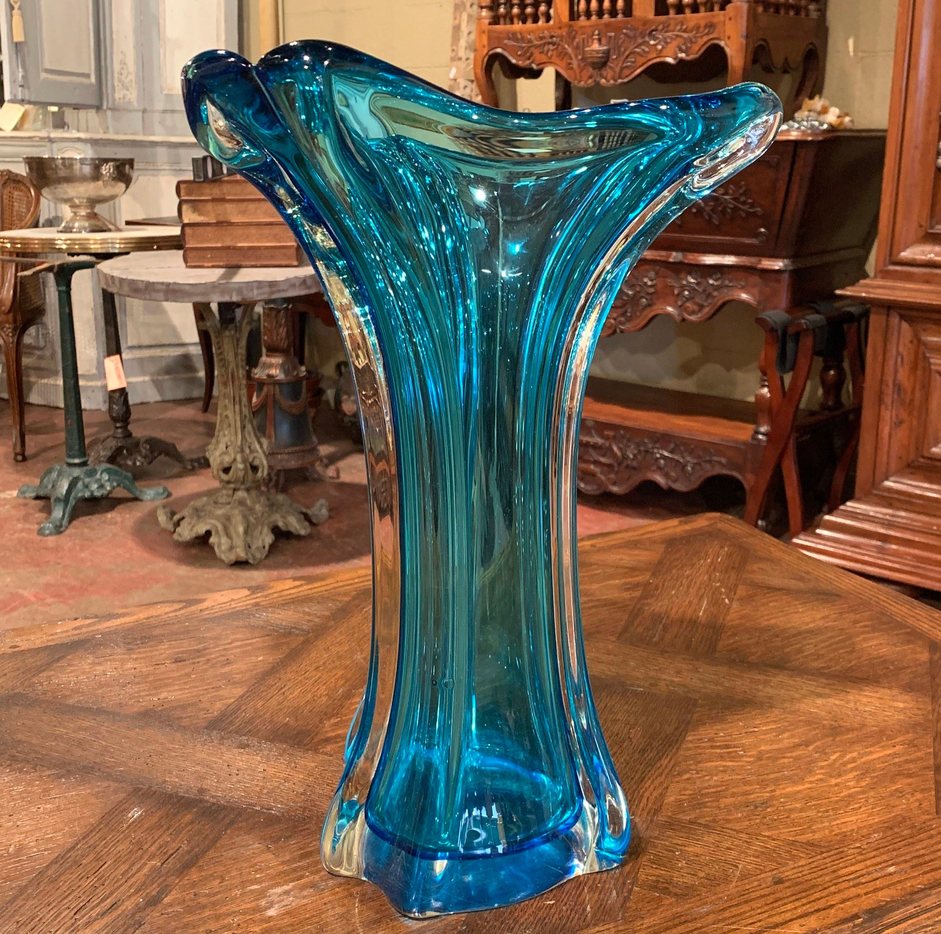 Decorate a table in your breakfast nook or entry way by filling this elegant, vintage vase with a bouquet of fresh flowers. Crafted in France circa 1950, the tall, Art Deco glass vase is hand blown for a unique, organic shape with a wide mouth at