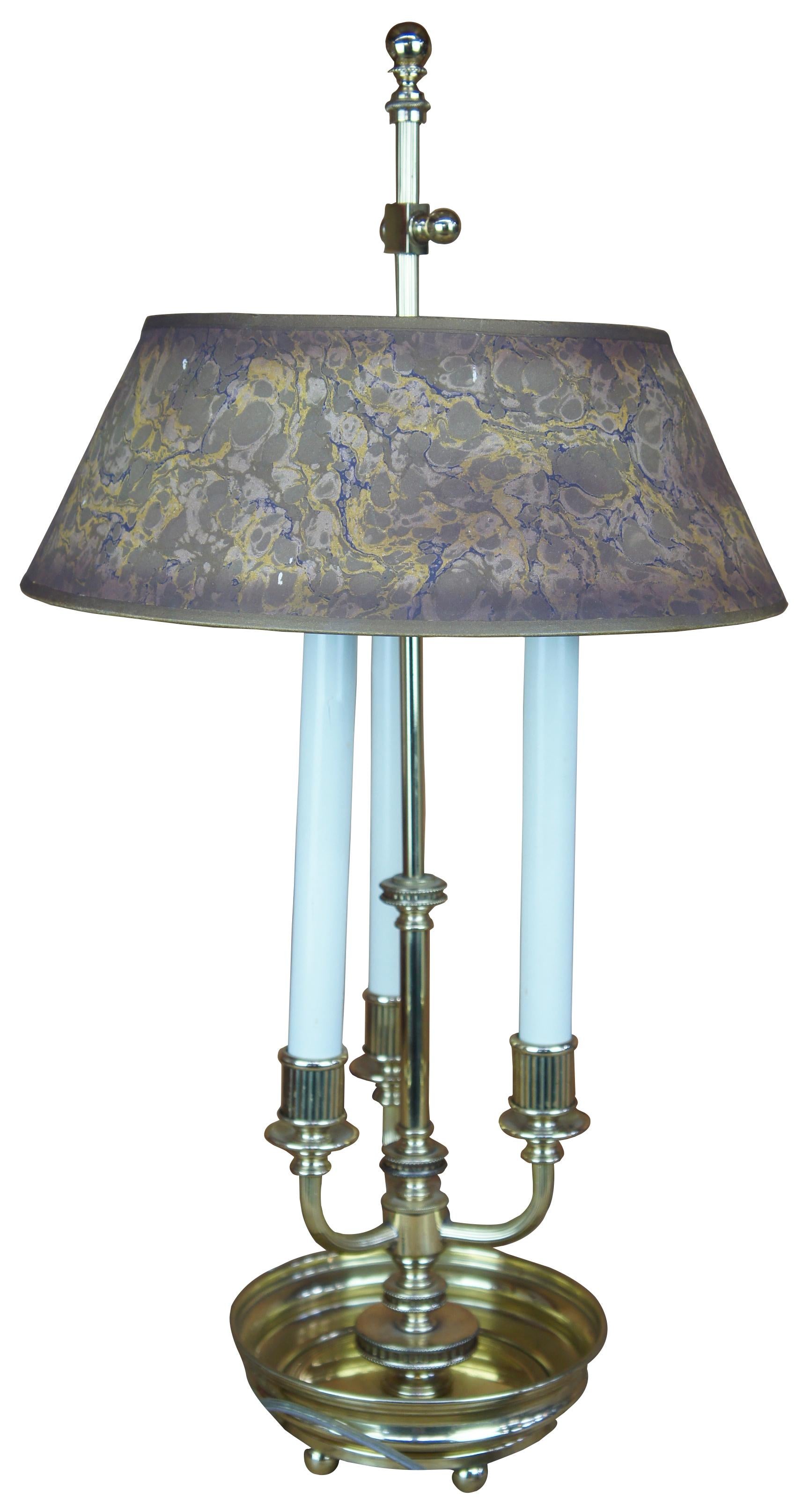 Mid century French Bouillotte table lamp. Made of brass featuring round footed circular tray base, three candlesticks lights and round marbled shade.
  