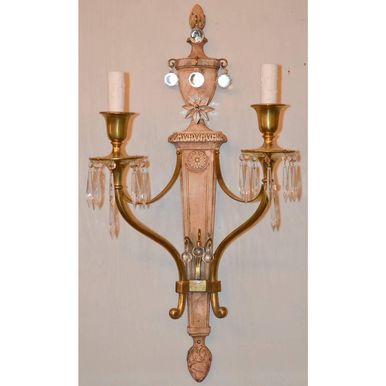 Pretty soft patinated pair of large two-arm sconces. Brass and crystals.
Made in France, circa 1940.