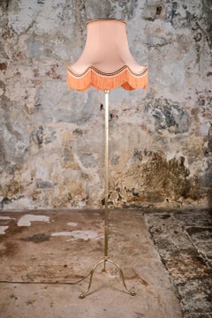 Mid-century French brass floor lamp with fringed coral lampshade, Art Deco