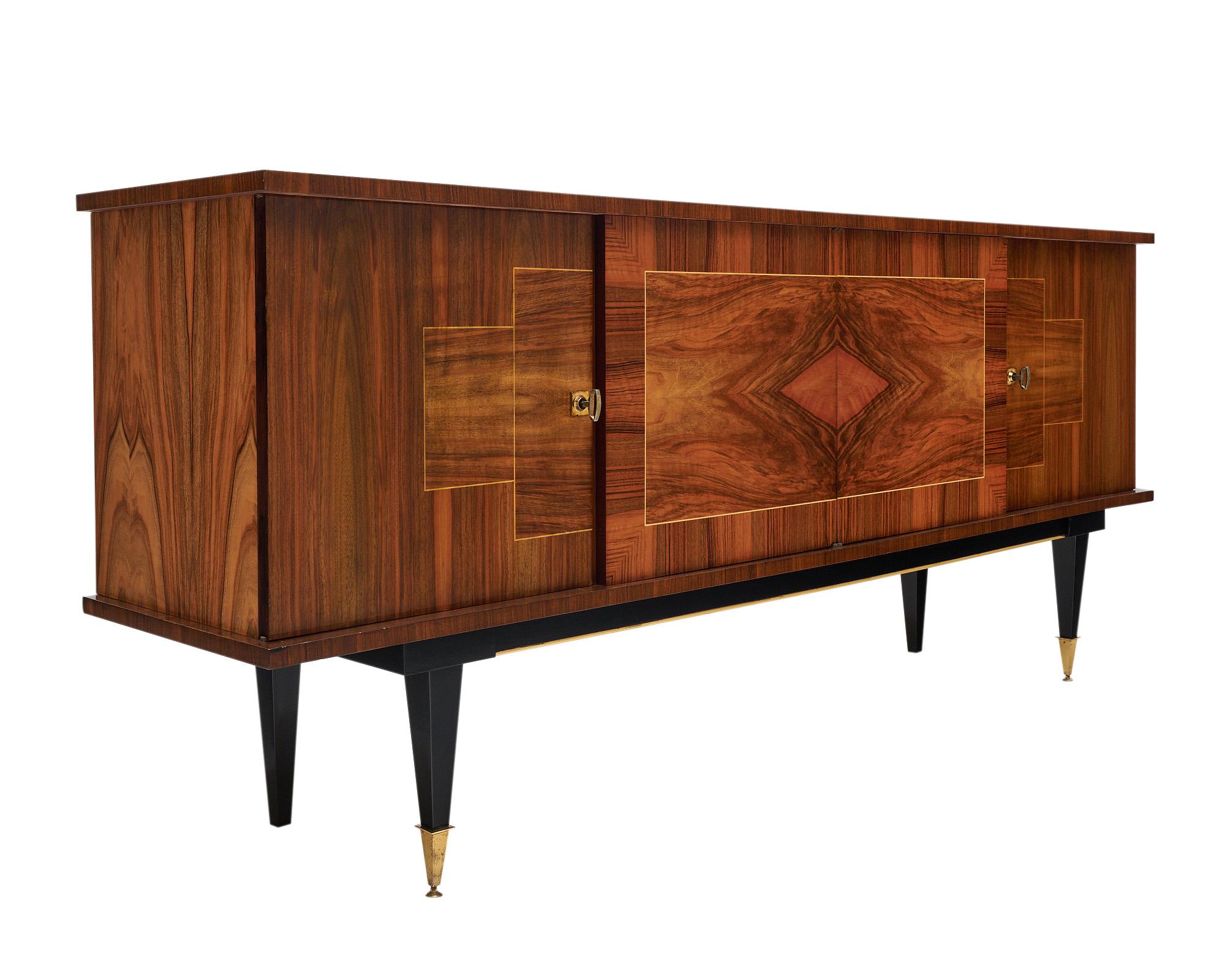 Buffet “enfilade “from mid-century France. The sideboard features a striking cubist design across the façade combining burled veneer walnut and lemonwood inlays that is quite eye-catching. There are four doors that open to interior shelving. The