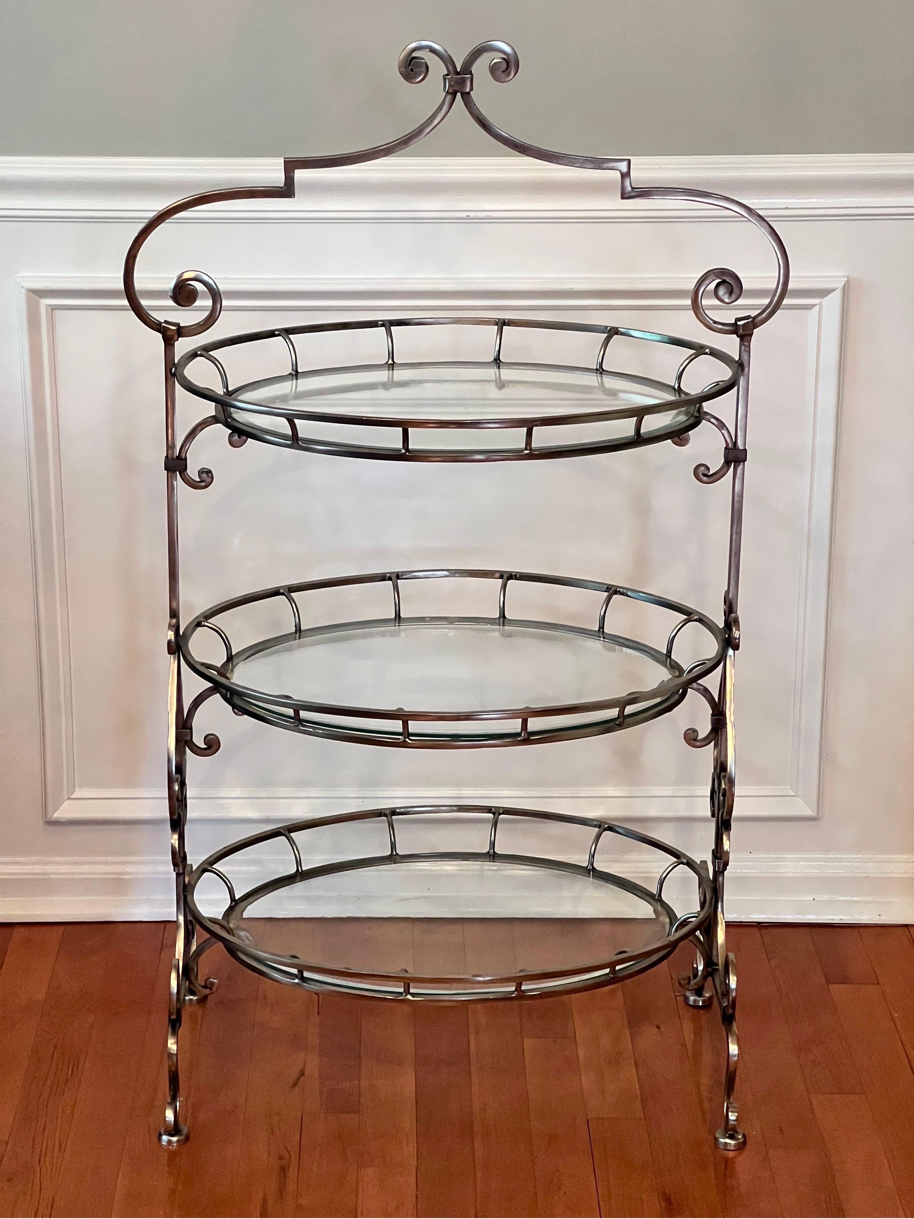 Elegant French style three tier patisserie stand with beveled glass. 

Perfect for serving desserts, the stand is adorned with graceful, silvered ornamental scrolling throughout. It is very sturdy with good weight and in very good condition. 