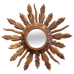 Miroir en bois sculpté et doré, peint en plein soleil, du milieu du siècle dernier