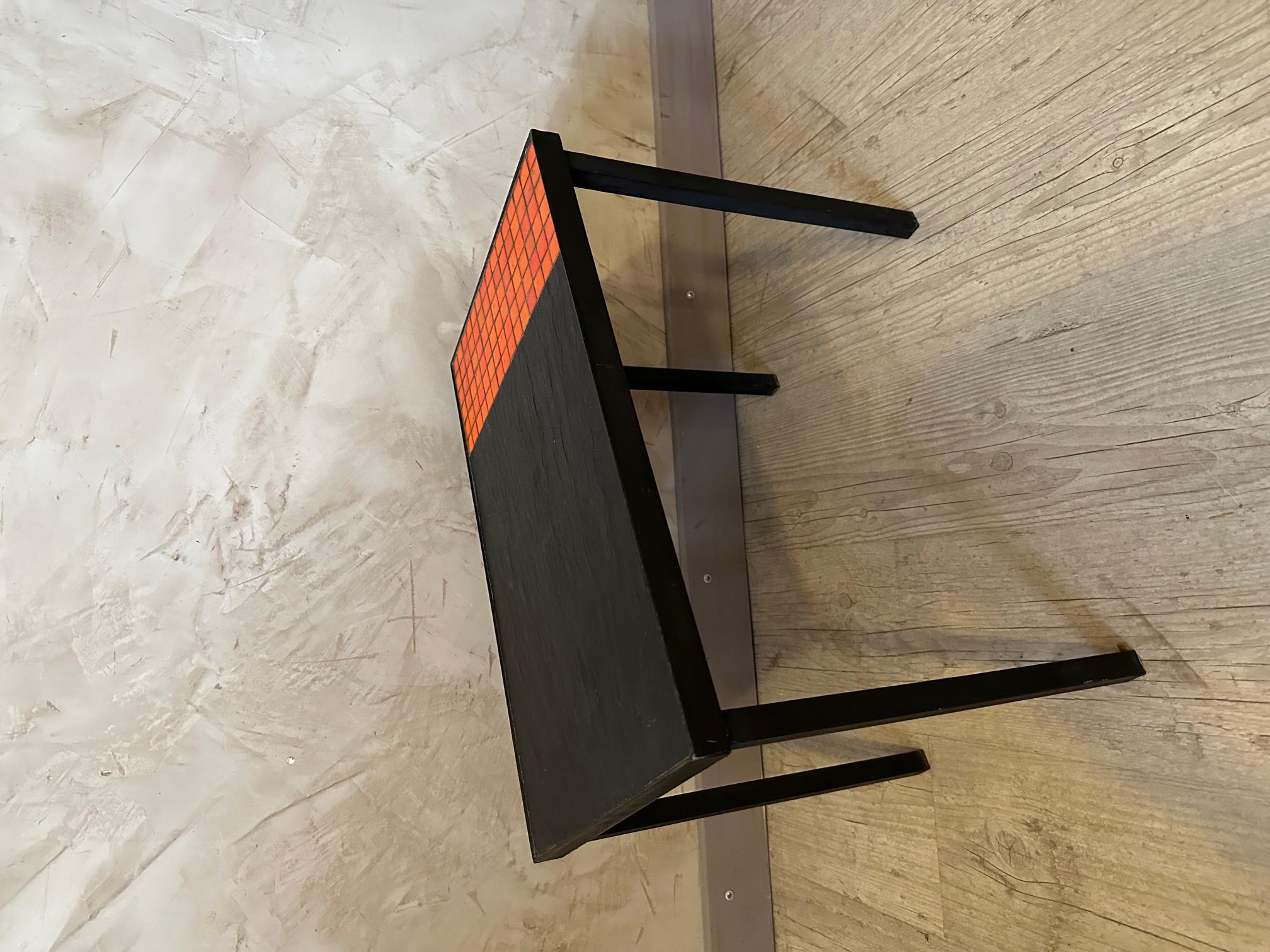 Small vintage side table from the 60s in the style of Roger Capron. 
Black metal base and half orange ceramic tile top and black stone effect tile.
Ideal as a bedside table or side table near a sofa. 
Good condition and good quality.