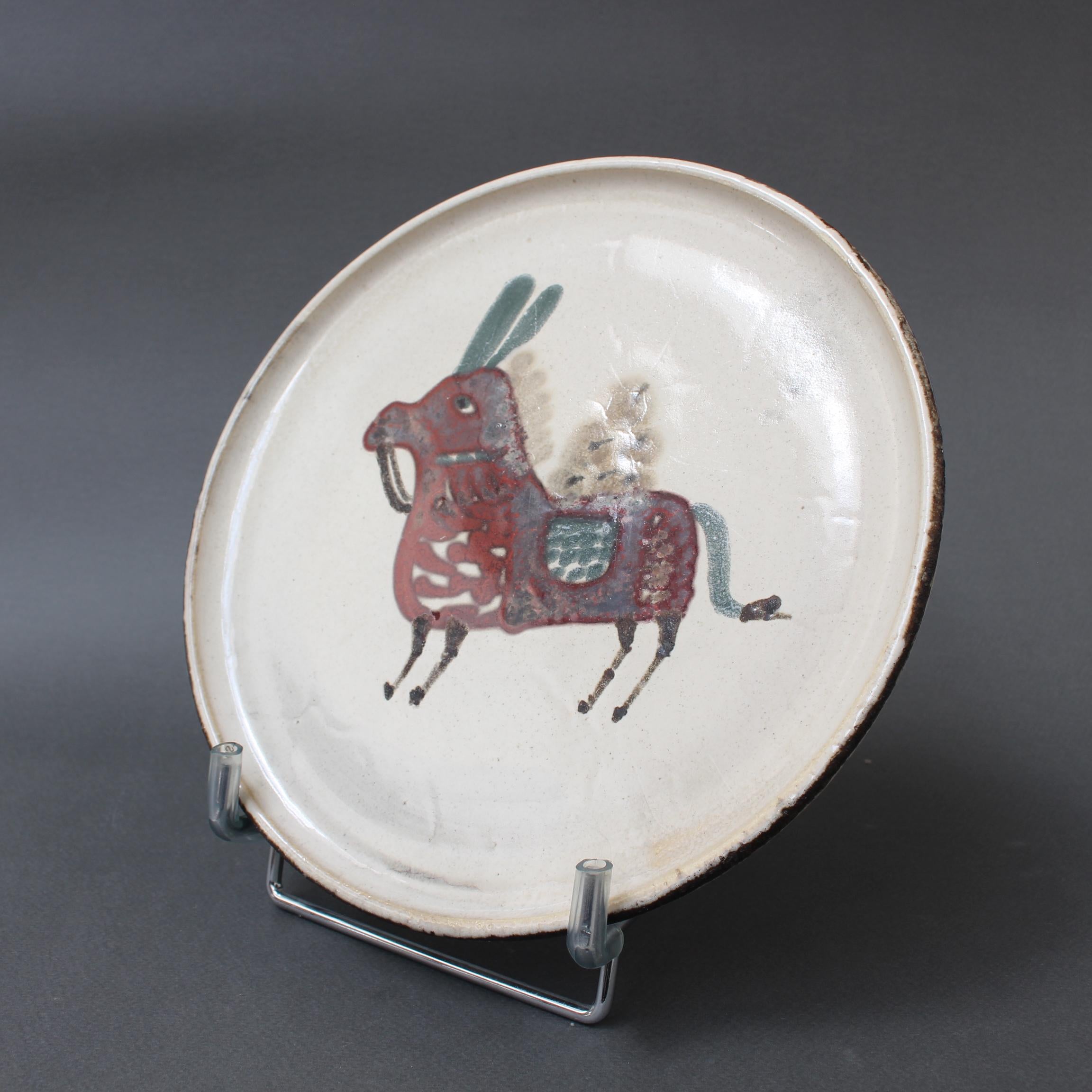 Mid-century French ceramic decorative plate by Le Mûrier (circa 1960s). A seductive piece with their signature style, chalk-white colour base with stylised donkey motif. In good overall condition. Maker's mark on the underside, Le Mûrier's trademark