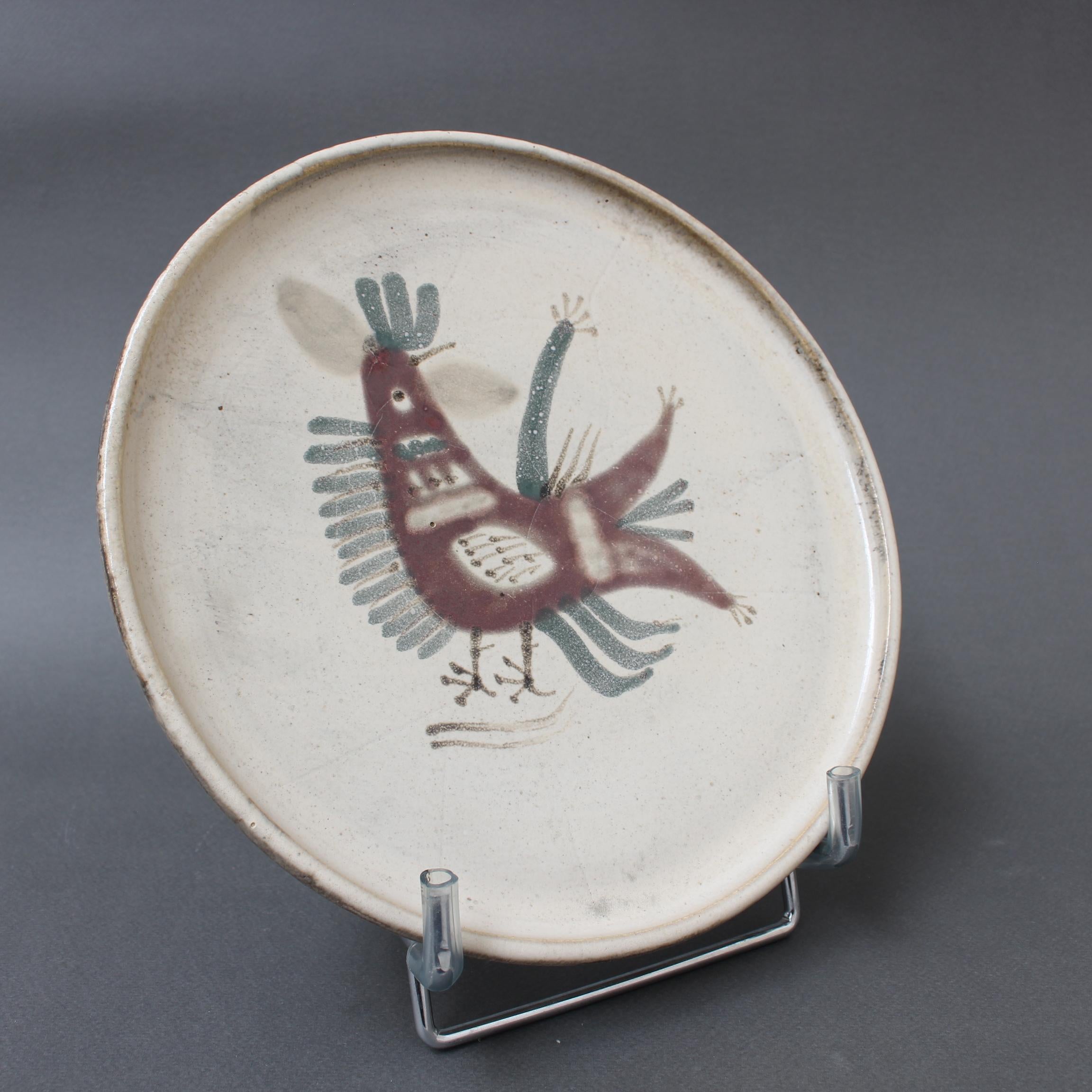Mid-century French ceramic decorative plate by Le Mûrier (circa 1960s). A seductive piece with their signature style, chalk-white colour base with stylised French coq motif. In good overall condition. Maker's mark on the underside, Le Mûrier's