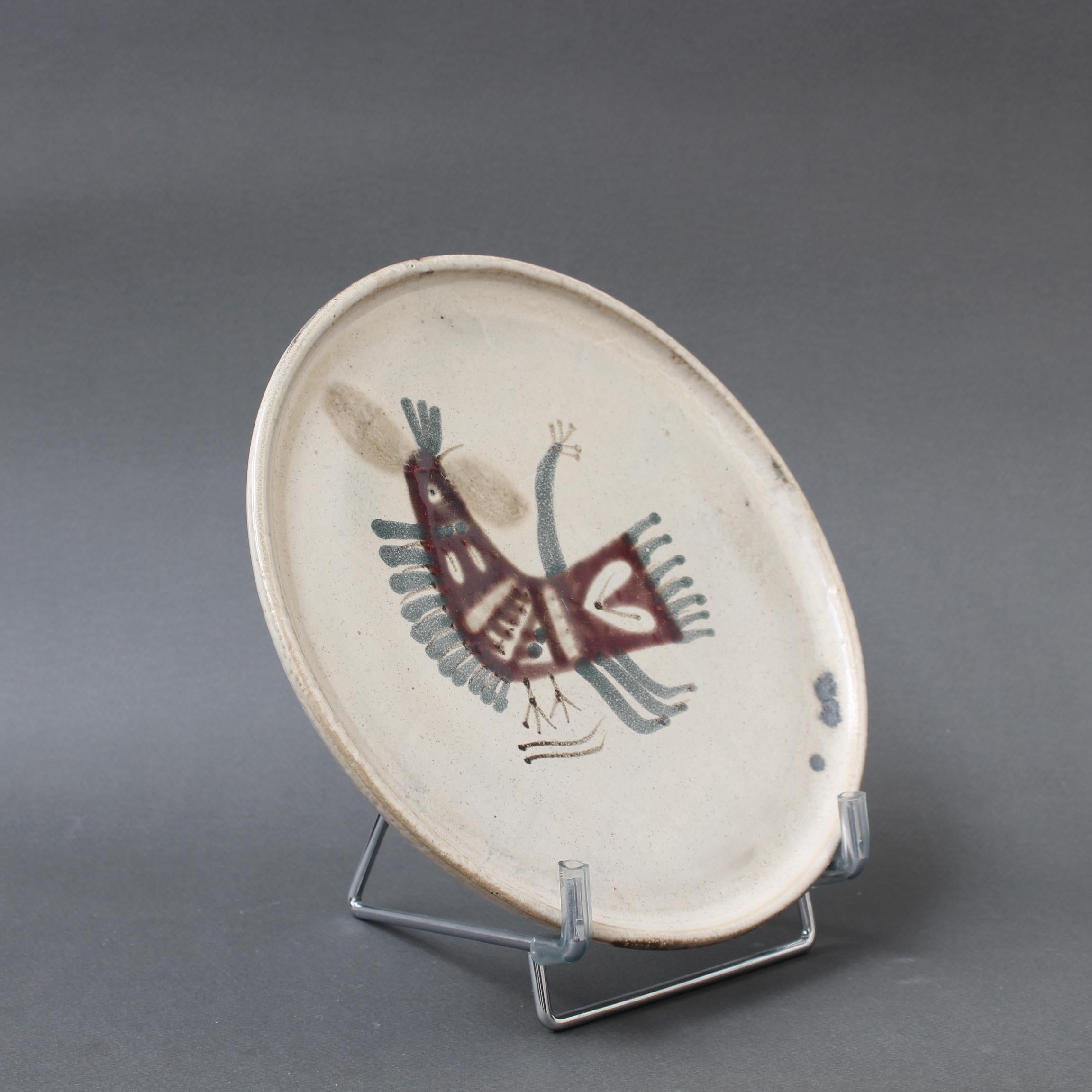 Mid-century French ceramic decorative plate by Le Mûrier (circa 1960s). A seductive piece with their signature style, chalk-white colour base with stylised French coq motif. In good overall condition. Maker's mark on the underside, Le Mûrier's