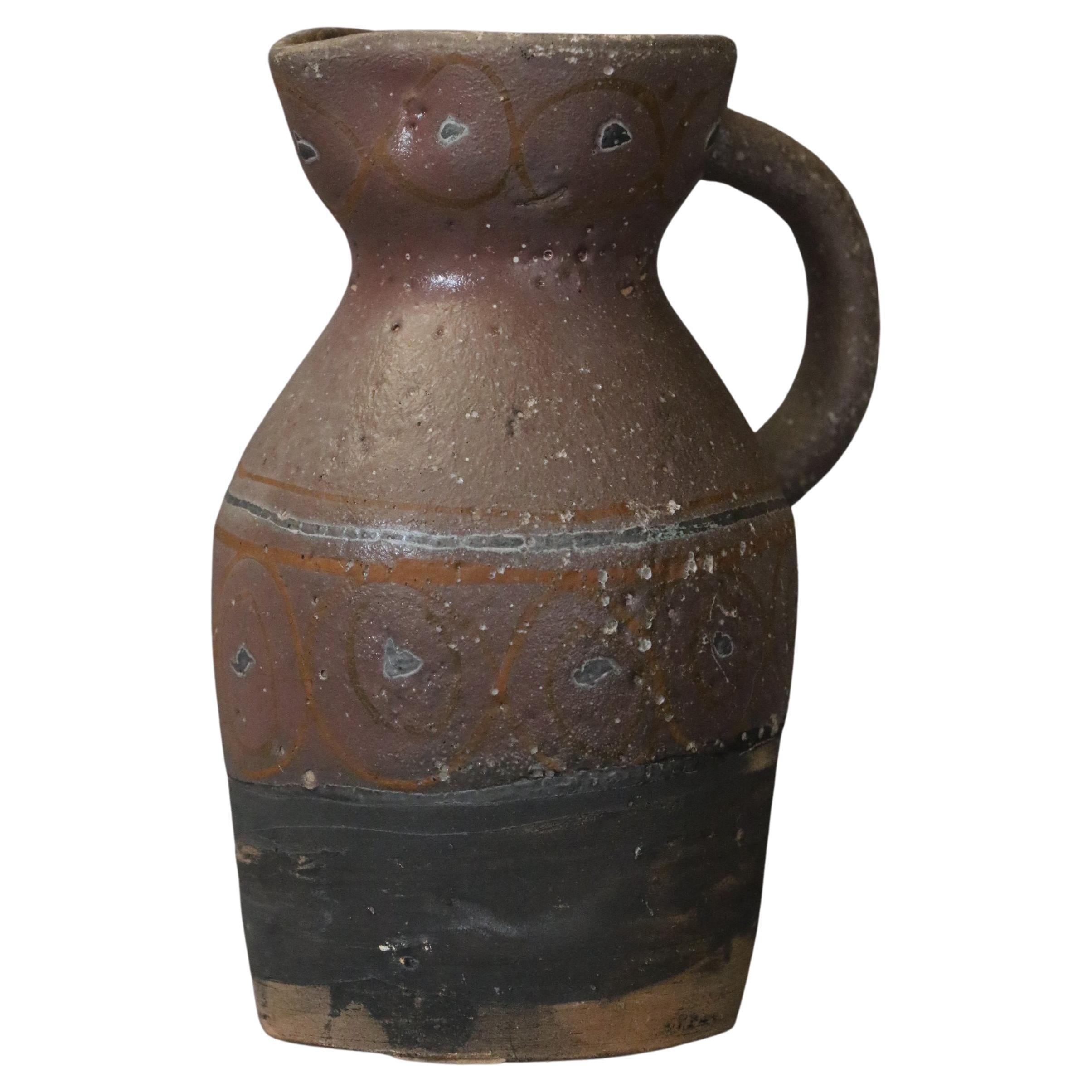 Mid-century French Ceramic Pitcher by Naumovitch - Grand Chêne Studio, Vallauris
Original piece, the pitcher is enamelled on the upper part and left rough on the lower part. The enamel is brown, slightly mauve, decorated with bluish dots and brick
