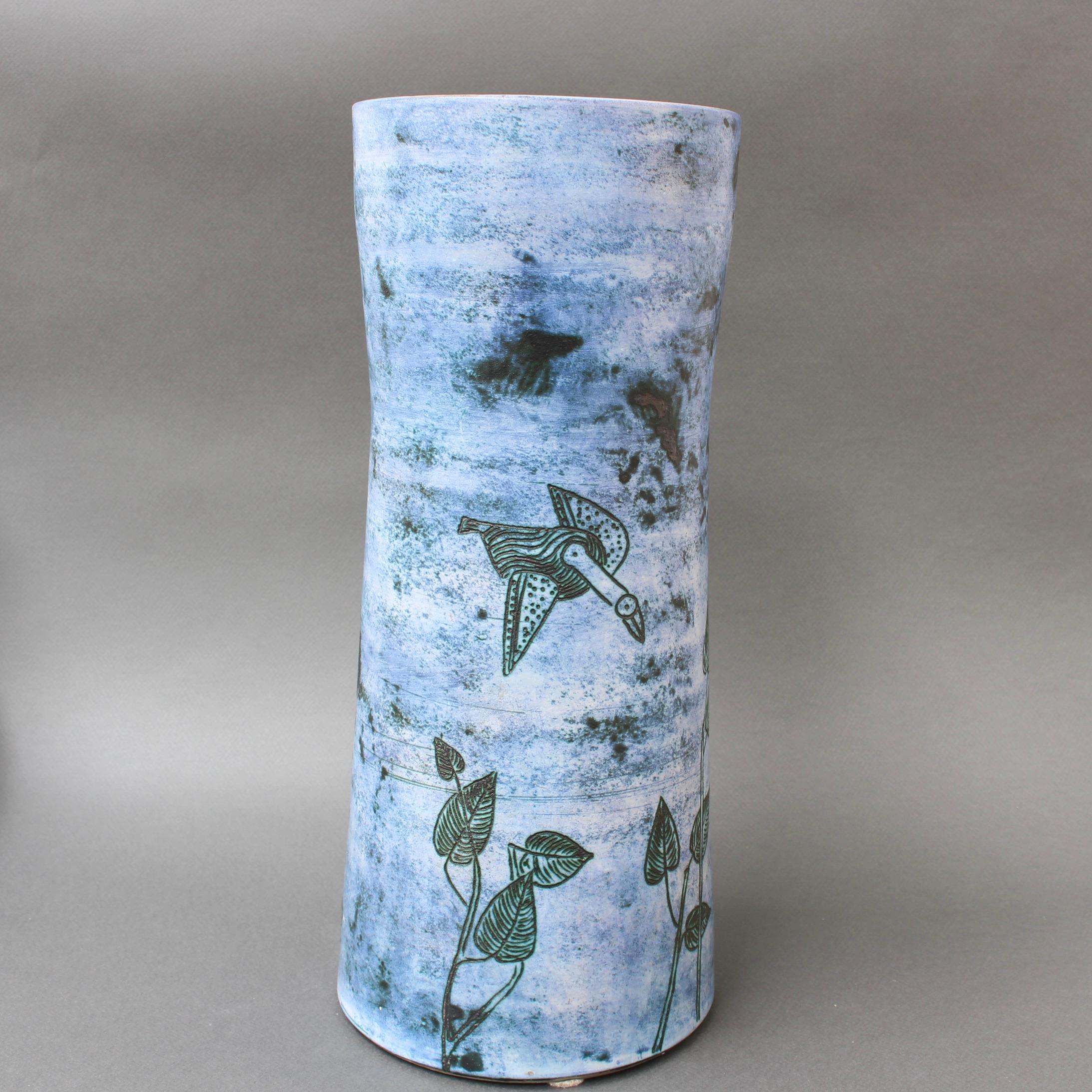 Large midcentury ceramic vase by Jacques Blin (circa 1950s). A delightful piece displaying Blin's trademark misty glaze with subtle blue hue on the exterior and green-oatmeal glaze on the inner lip and interior. Stylised birds flying over leafy