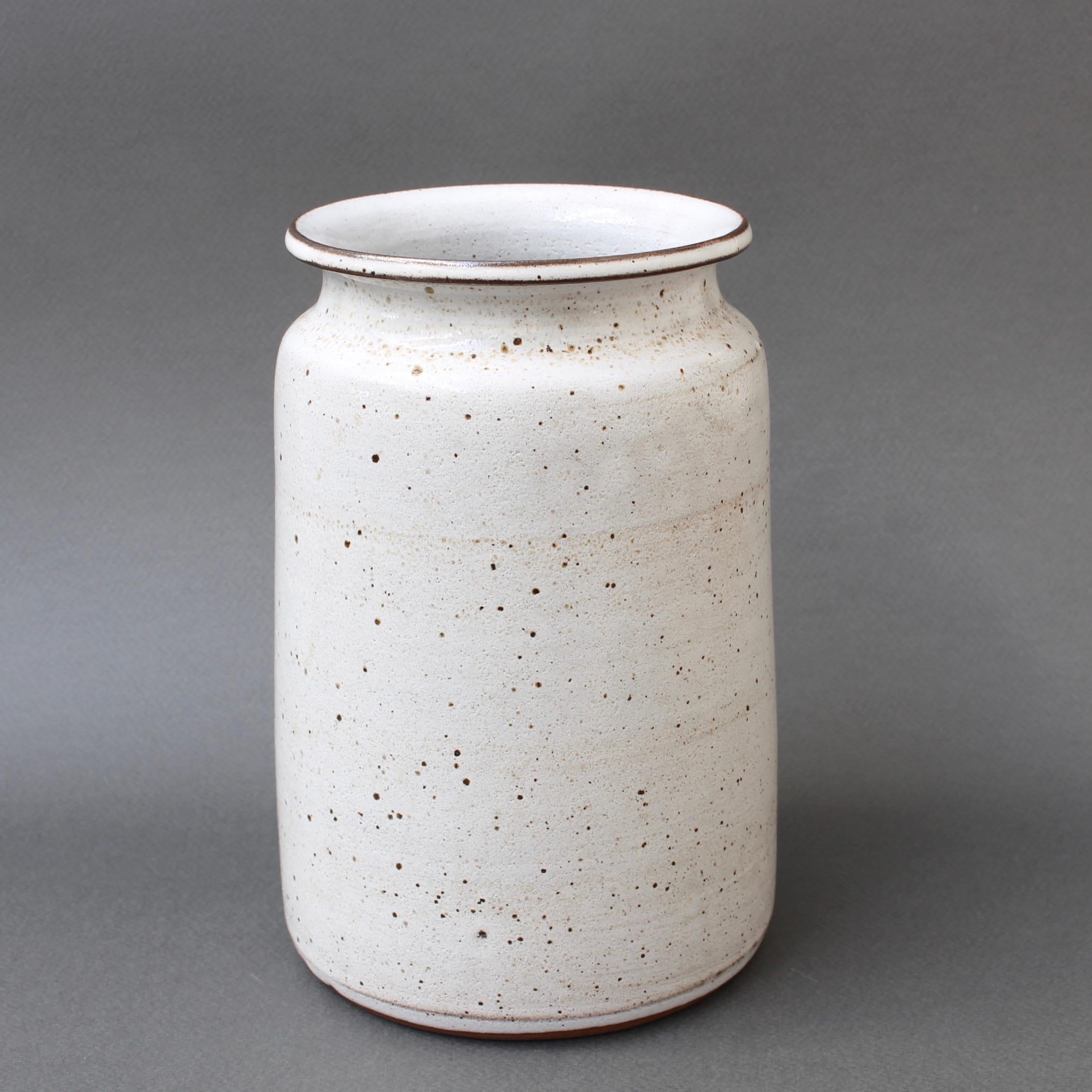 Midcentury ceramic vase by Jacques Pouchain / Atelier Dieulefit (circa 1960s). A mason's jar-shaped vase is unusual for the ceramicist in its mostly white surface. Pouchain's signature cloudy glaze has been replaced in this piece by a chalky-white,