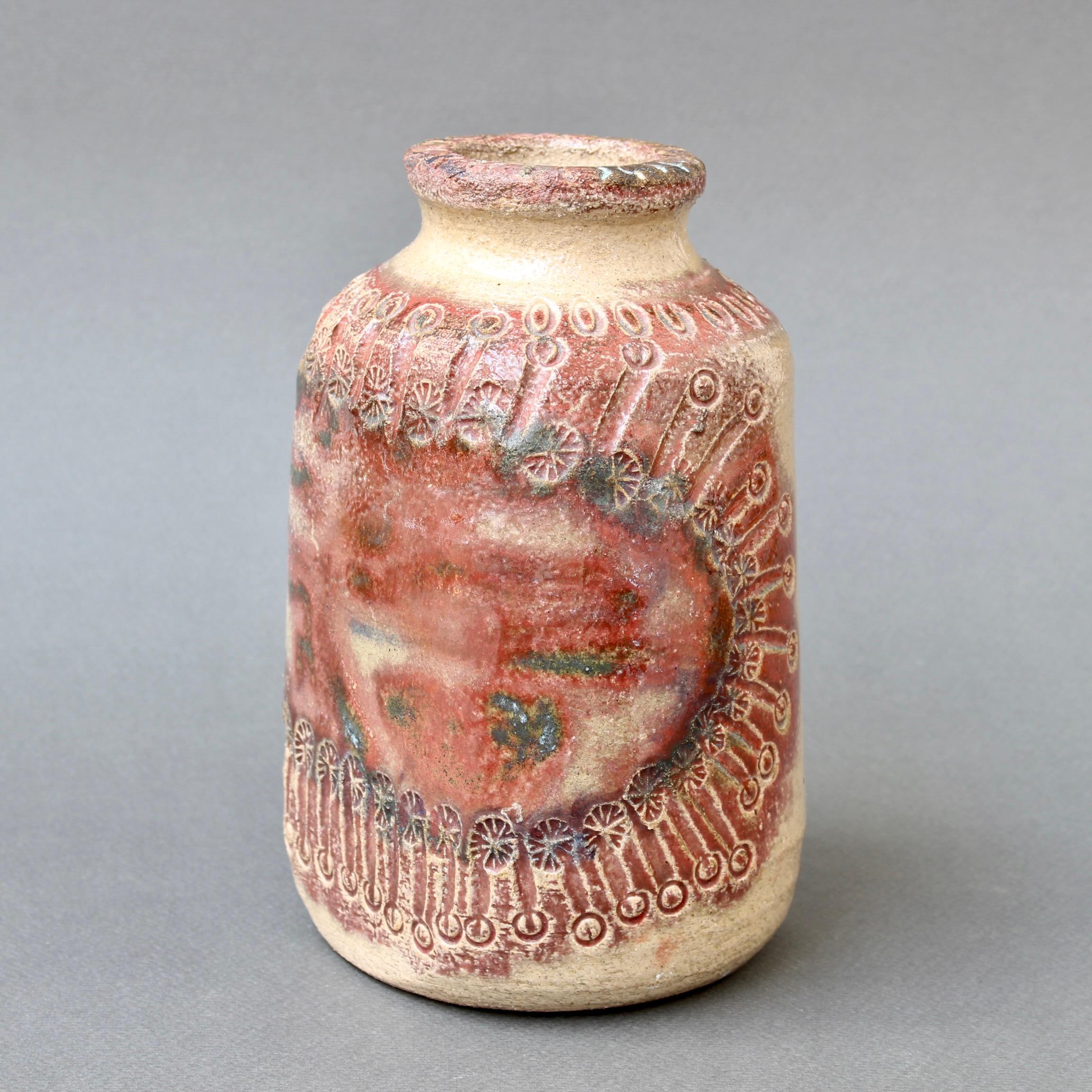 Mid-century ceramic vase (circa 1970s) by Marcel Giraud, Vallauris, France. A rustic, charming piece with a mostly red frieze in abstract surrounded by stylised sun flowers incised into the enamel. On the opposite side the viewer finds curvy lines