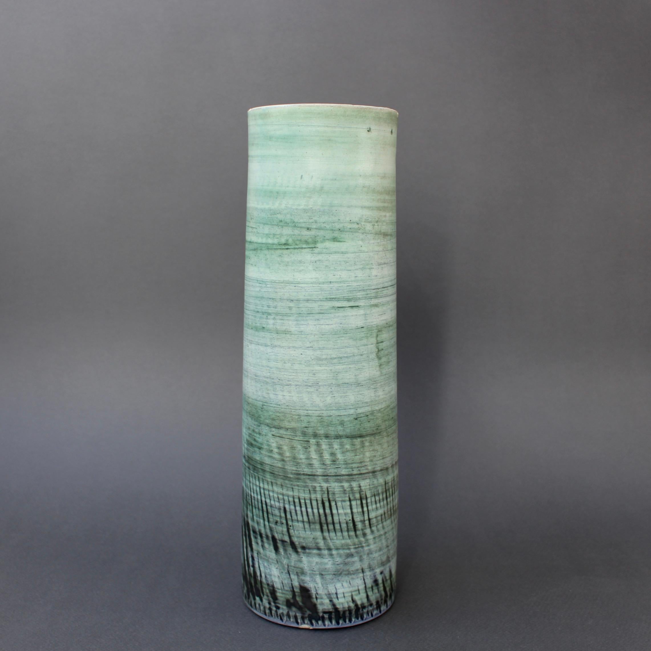 Mid-century French ceramic vase by Tapis Vert (circa 1960s). Elegant, graceful and sophisticated, this is a wonderful piece of subtle hue and masterful craftsmanship. The horizontal lines formed from the potter's throwing are reminiscent of a misty