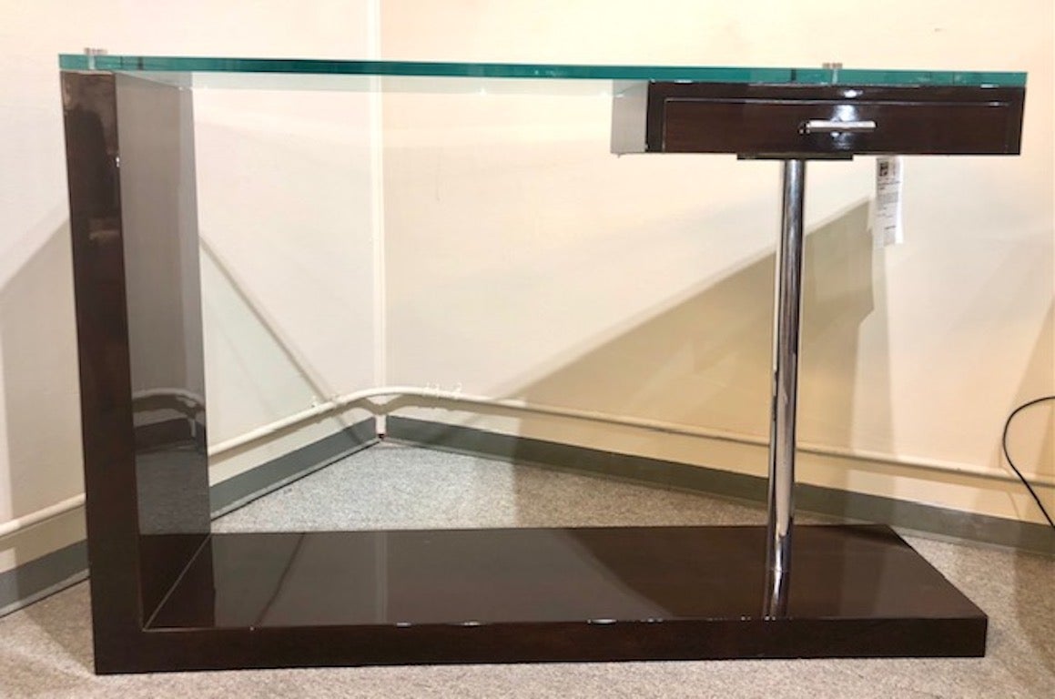 Unique console made out of three materials: wood, glass and chrome. Bottom part and one of the sides are made out of walnut wood. Top of the console is glass and another side is made out of chrome tube.
Condition is perfect. 

France, circa