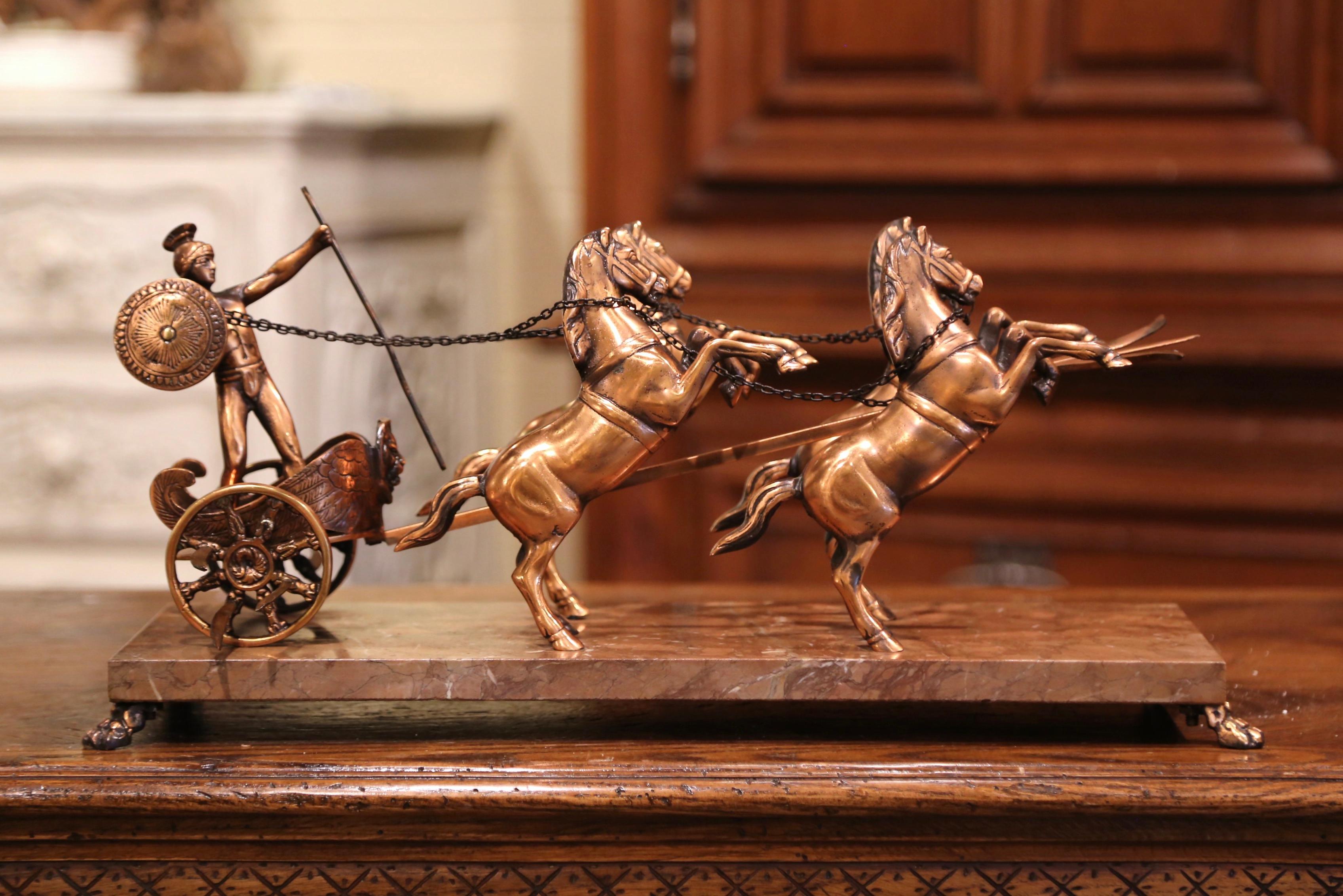 Decorate a study or office shelf with this interesting Roman Empire chariot composition; crafted in France circa 1950, the sculpture depicts a copper and brass racing chariot pulled by four elegant horses, with a Roman soldier standing inside the
